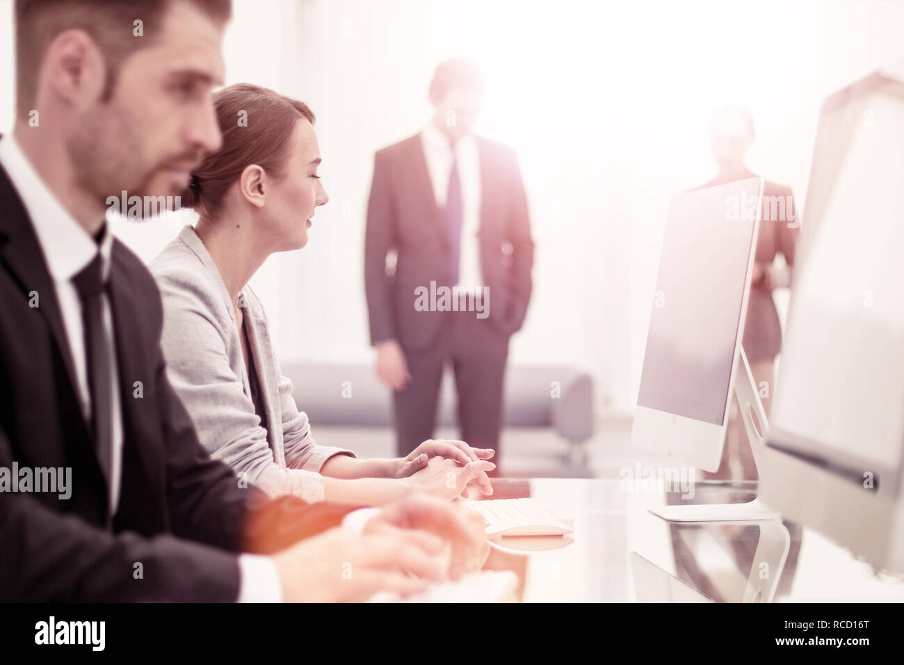 employees work on computers in the Bank lobby Stock Photo - Alamy