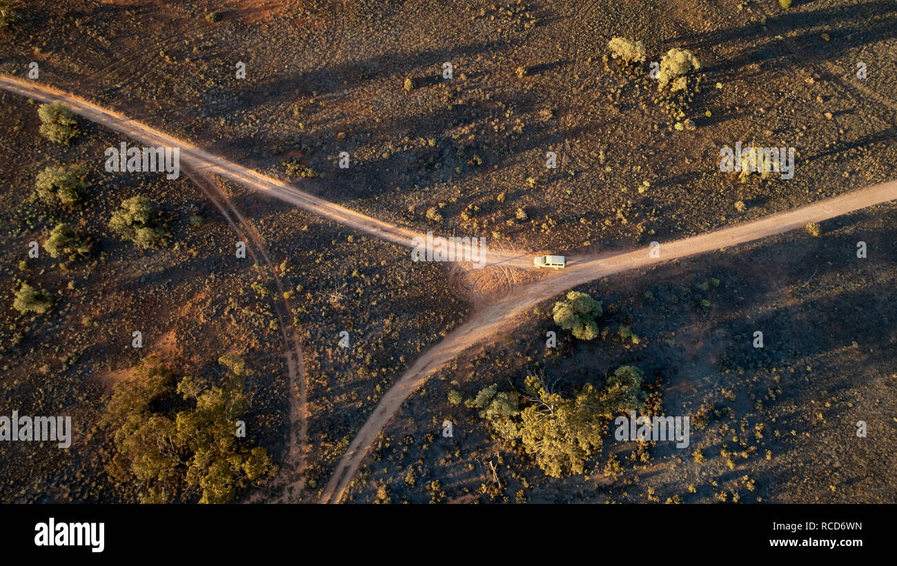 Aerial of heavy duty 4x4 at intersection of bush track. Stock Photo
