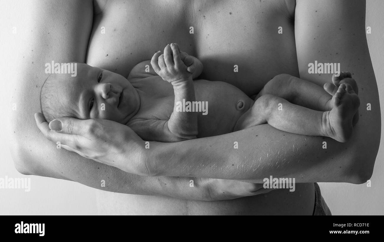 Mother holding a newborn baby Stock Photo