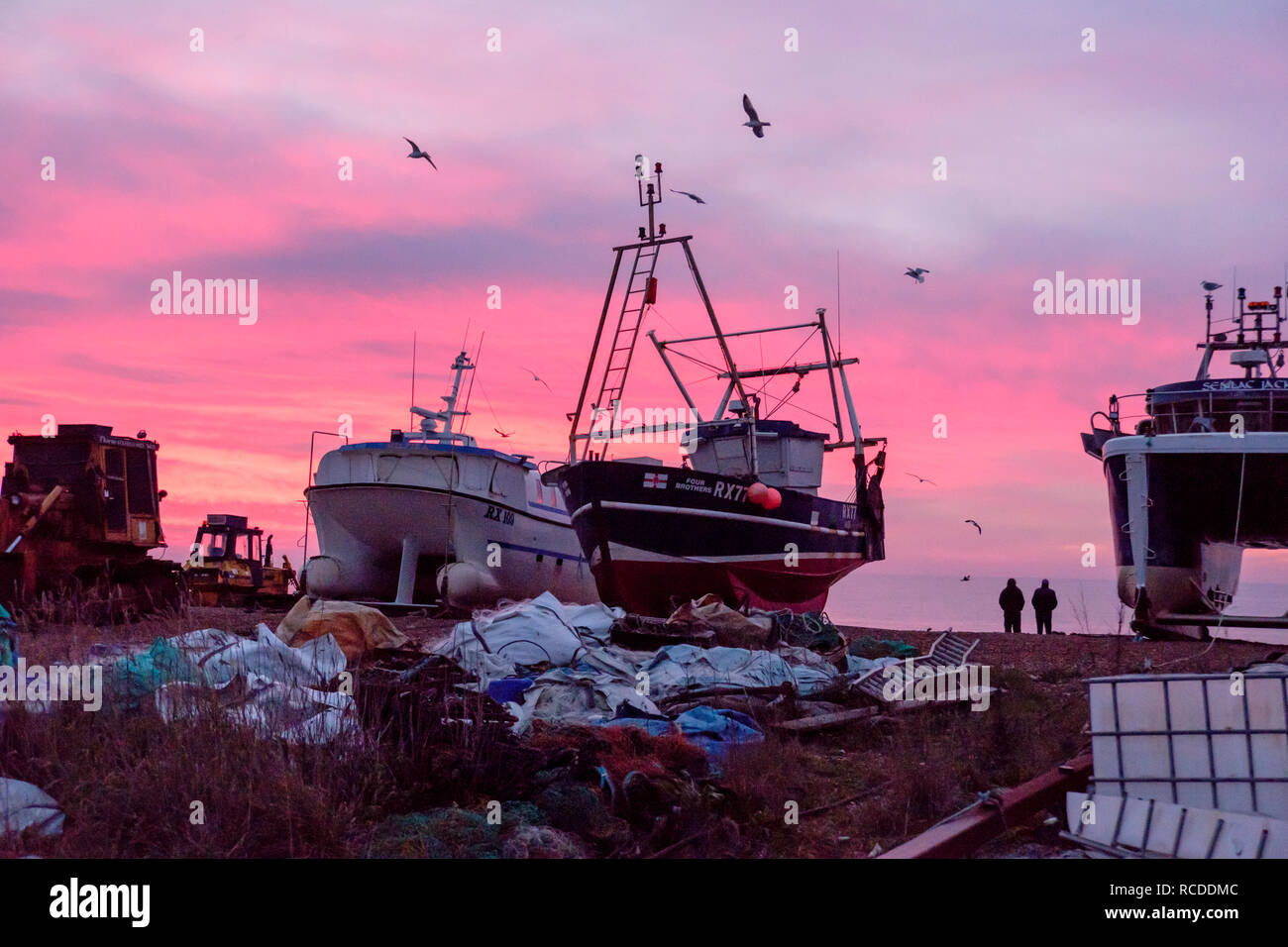 Hastings, East Sussex: Colourful dawn on the Stade fishermen's beach. Hastings has the largest beach-launched fishing fleet in Europe. 27th Dec 2018 Stock Photo
