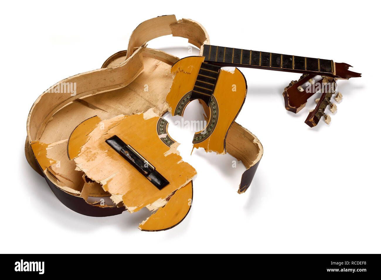 A smashed and broken acoustic guitar Stock Photo - Alamy
