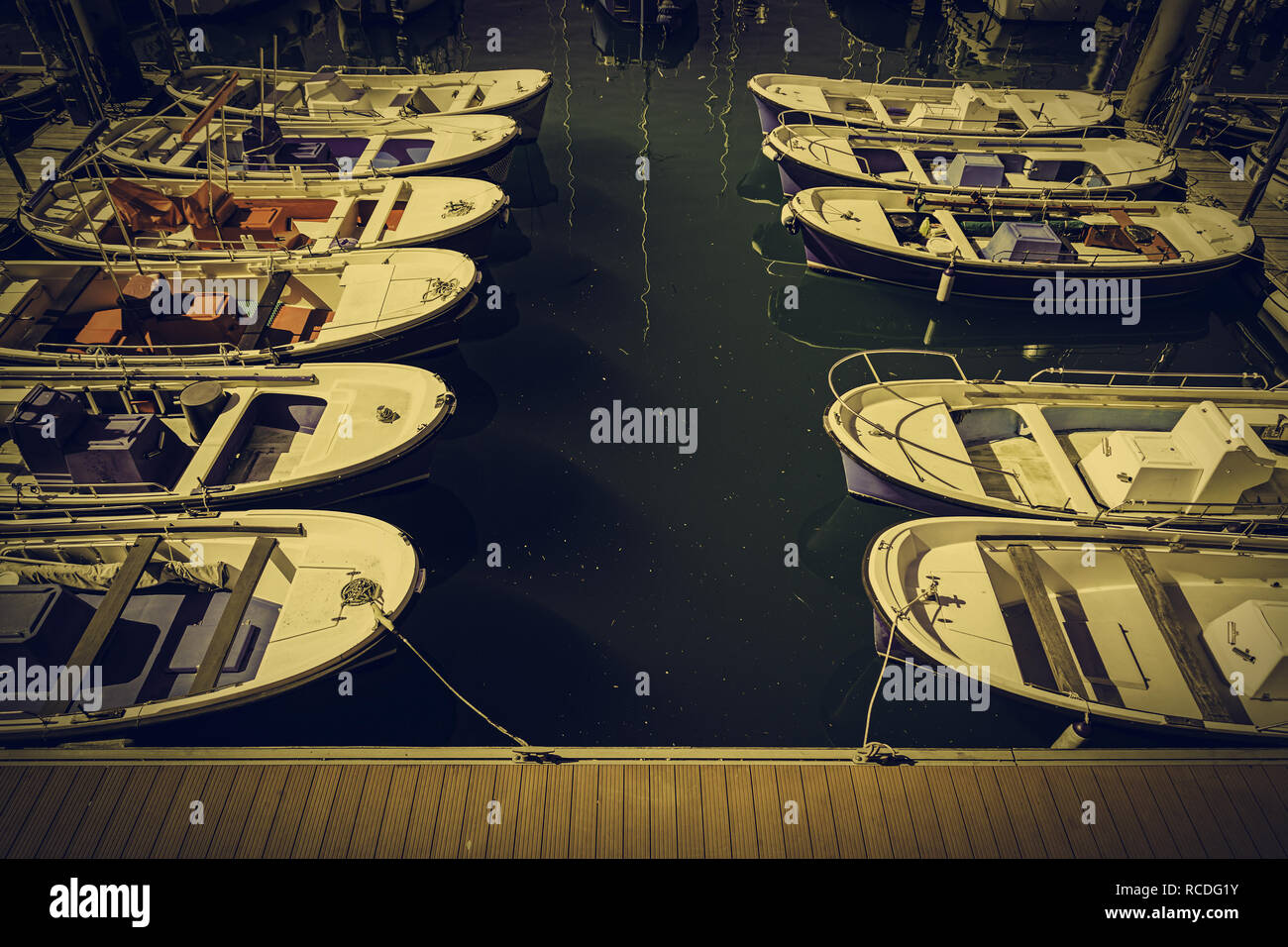 Boats moored at a marine dock, detail of recreational boats on a dock ...