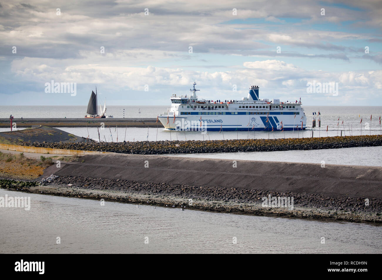 The Netherlands, Harlingen. Car very from the island of Terschelling arrives in harbour, port