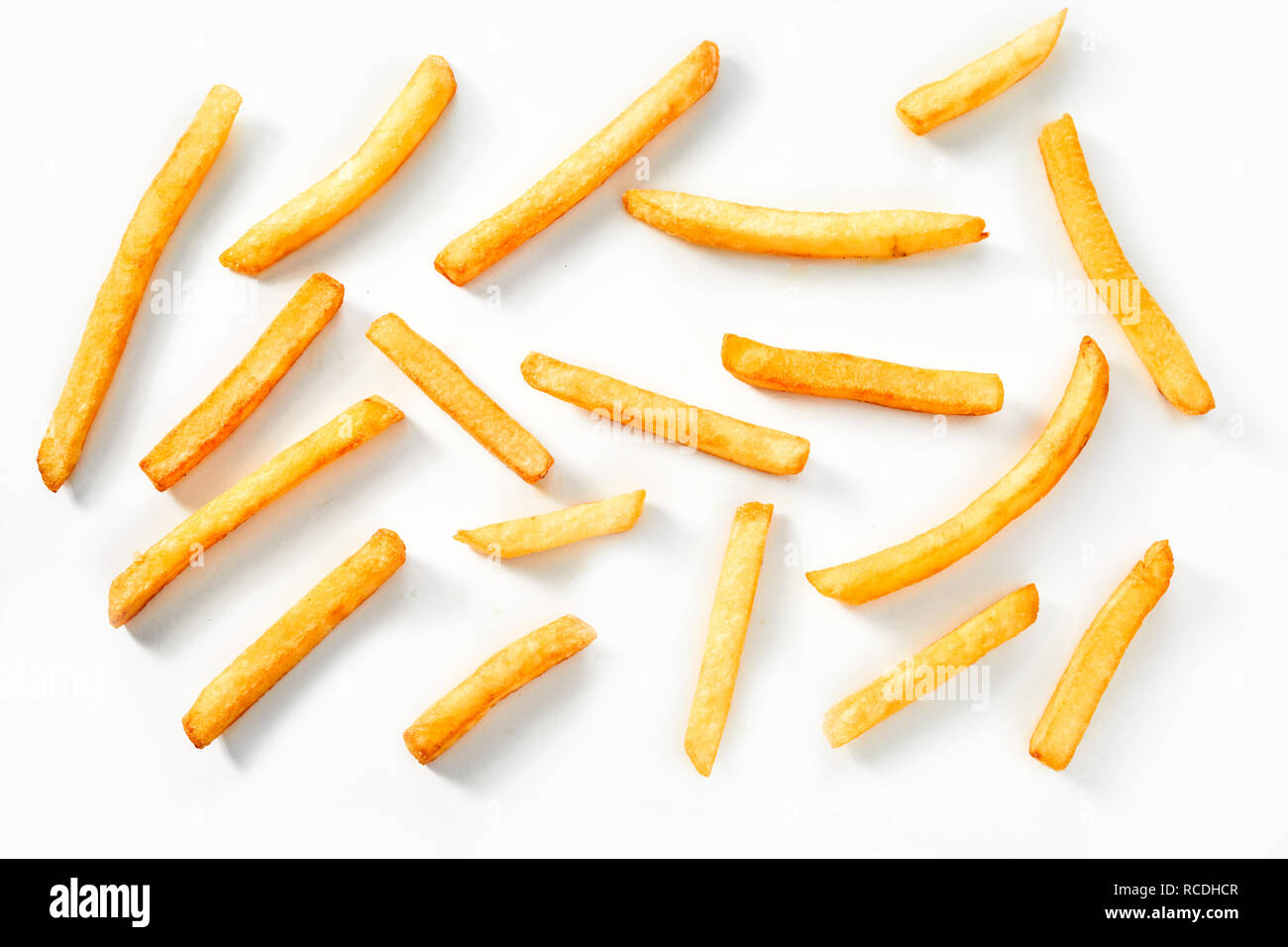 Flat lay view of deep fried crispy thin straight potato chips, French