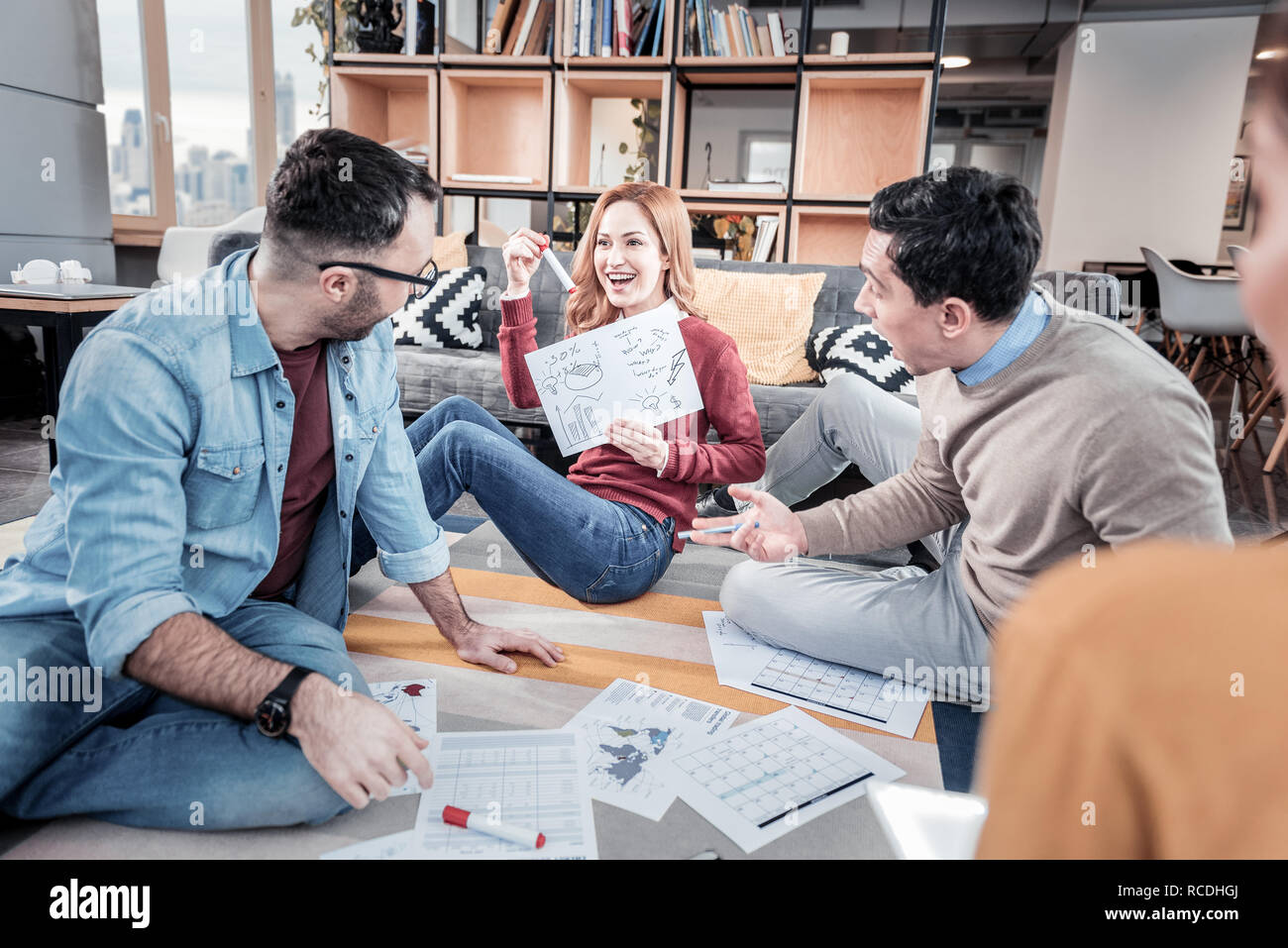 Exuberant woman presenting her idea Stock Photo - Alamy