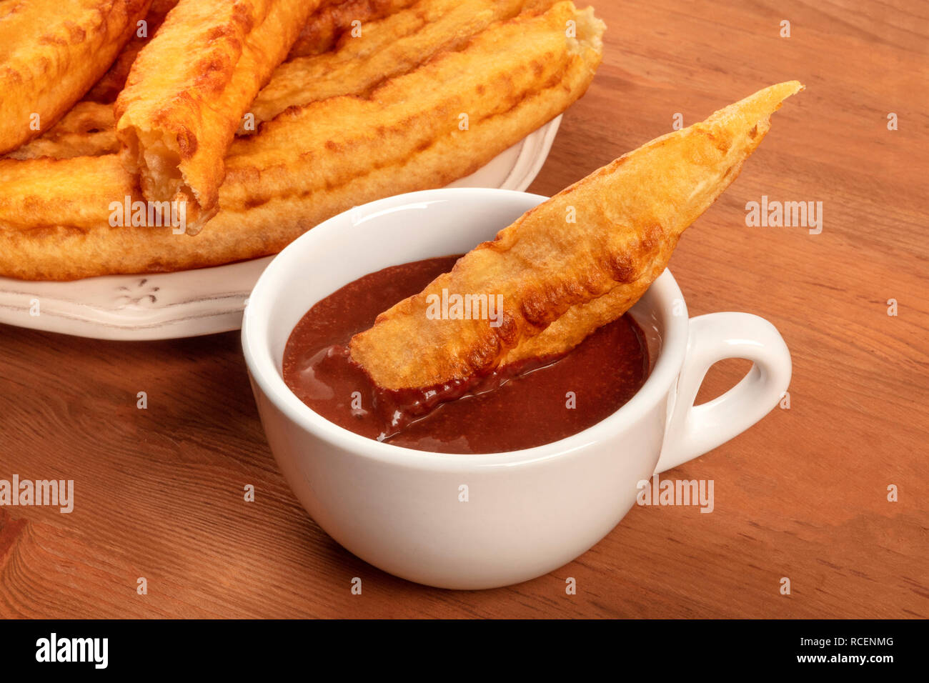 Traditional Spanish porras dipped in hot chocolate, a typical Madrid