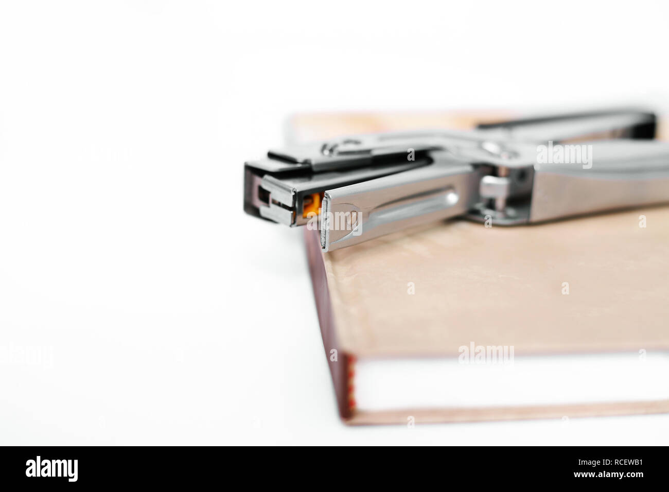 Diary with stapler. Isolated on the white background. Stock Photo