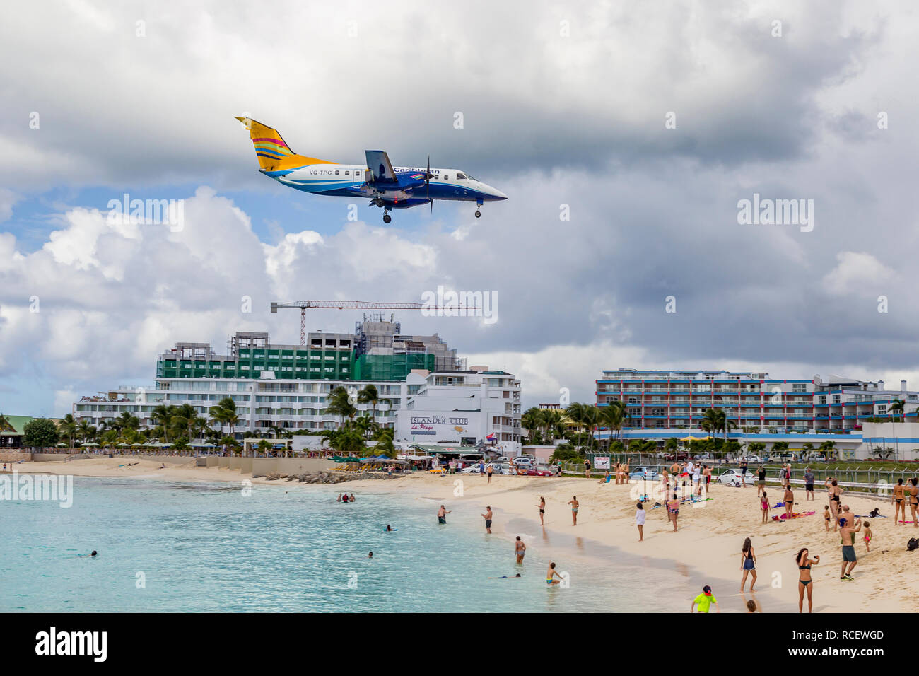InterCaribbean Airways, VQ-TPG, Embraer EMB-120ER Brasília flying in low over Moho bay into Princes Juliana airport in St Marten. Stock Photo