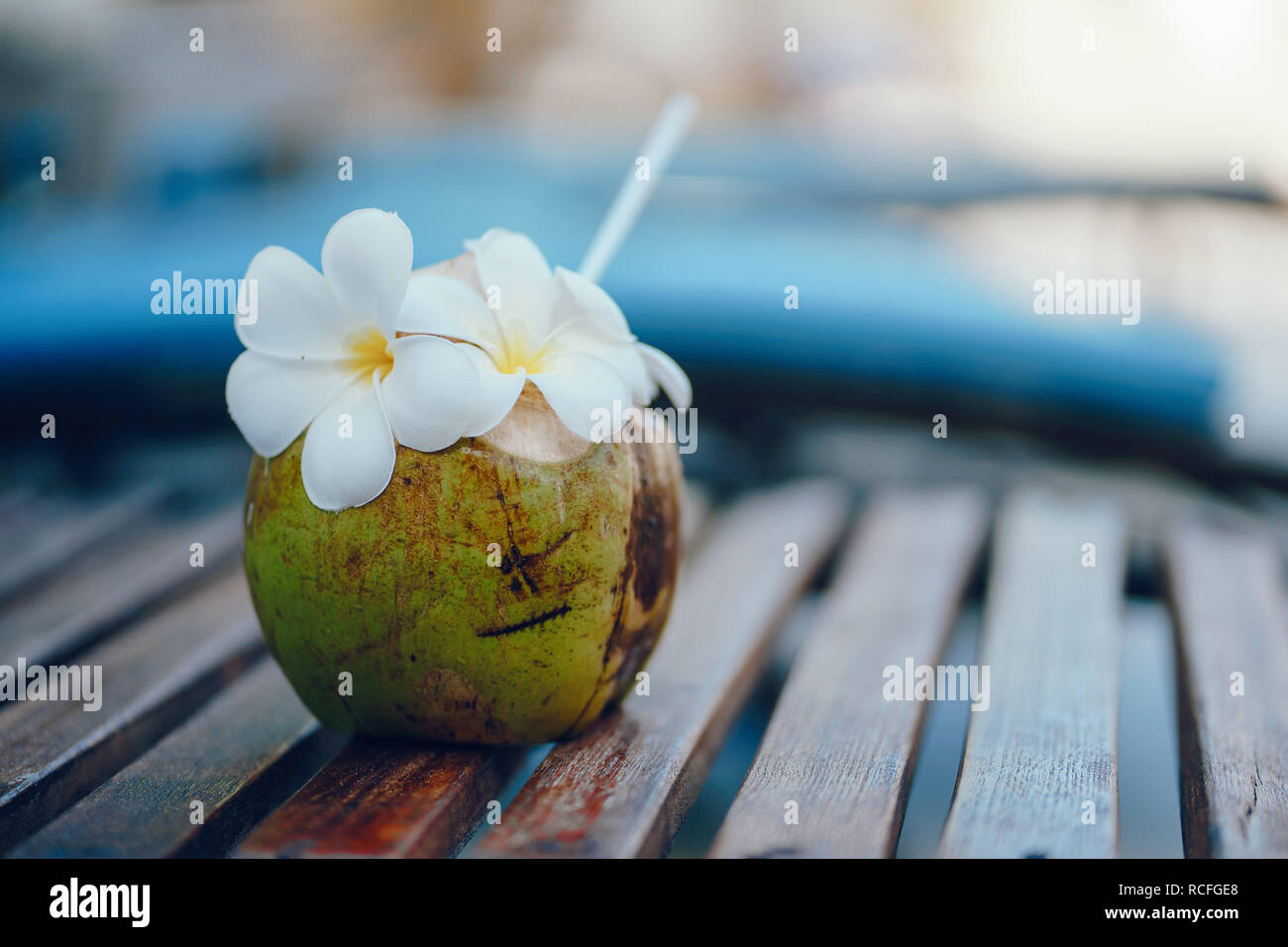 Green coconuts with drinking straw Stock Photo Alamy