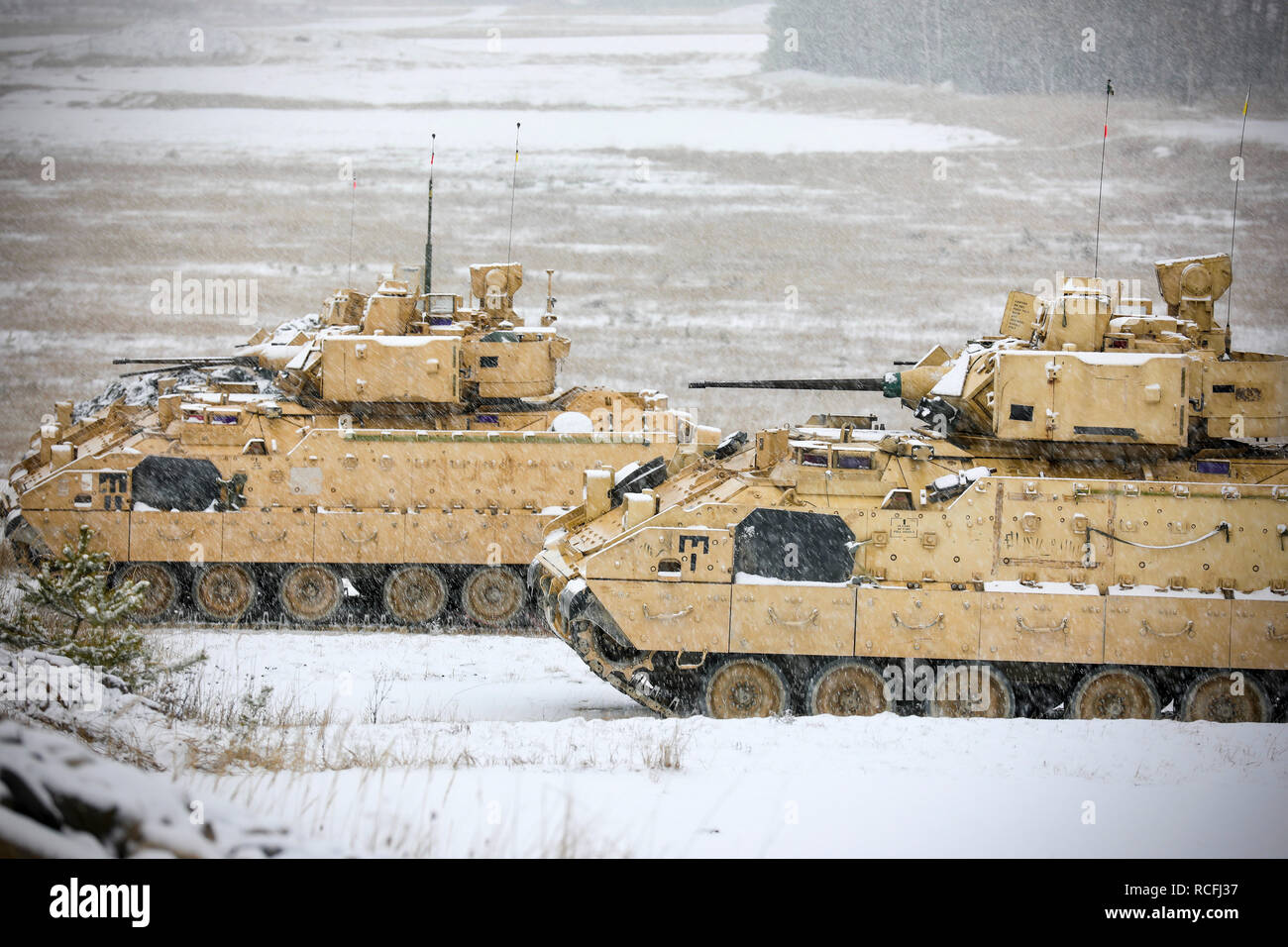 U.S. Army Bradley Fighting Vehicle crews assigned to the 91st Brigade Engineer Battalion, 1st Armored Brigade Combat Team, 1st Cavalry Division acquire their targets prior to live fire at Camp Aachen in Grafenwoehr, Germany Jan. 12, 2019. 91st BEB and 1-1 CD Soldiers are completing their rotation for Atlantic Resolve in Europe by completing live fire exercises and gunnery tables.  (U.S. Army National Guard photo by Sgt. 1st Class. Ron Lee, 382nd Public Affairs Detachment, 1ABCT, 1CD released) Stock Photo