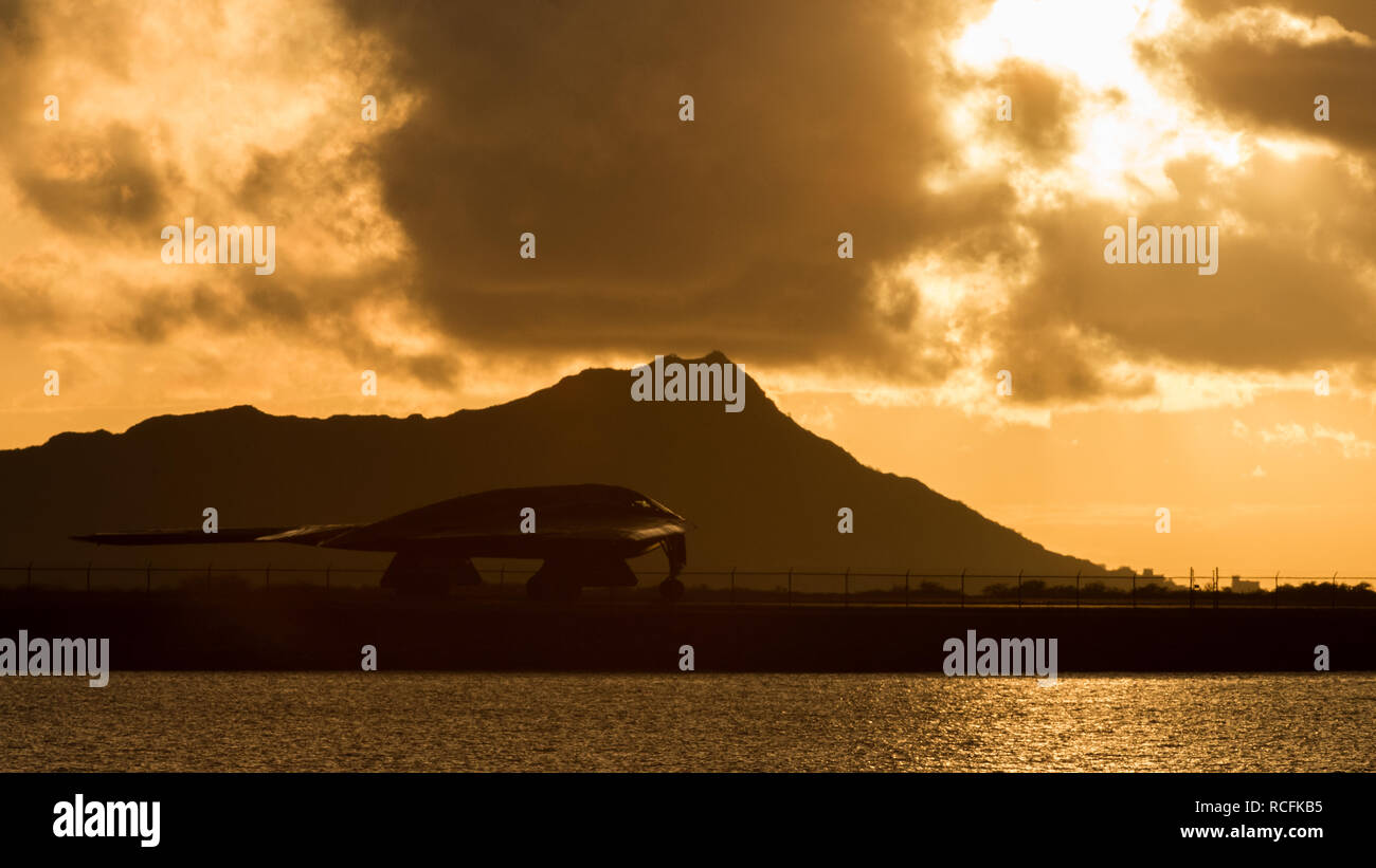 A U.S. Air Force B-2 Spirit bomber deployed from Whiteman Air Force Base, Missouri, taxis down the runway at Joint Base Pearl Harbor-Hickam ( JBPH-H), Hawaii, Jan. 14, 2019. Three B-2 Bombers arrived to JBPH-H on Jan. 10, 2019 in support of U.S. Strategic Command’s (USSTRATCOM) bomber task force mission. Stock Photo