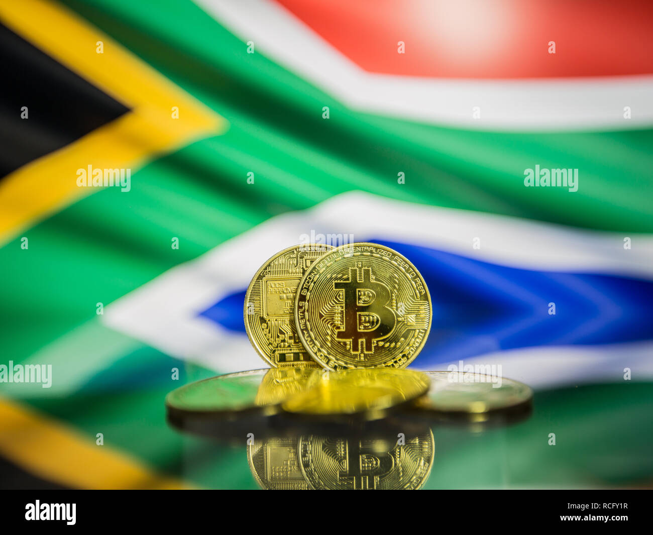Bitcoin gold coin and defocused flag of South Africa background. Virtual  cryptocurrency concept Stock Photo - Alamy