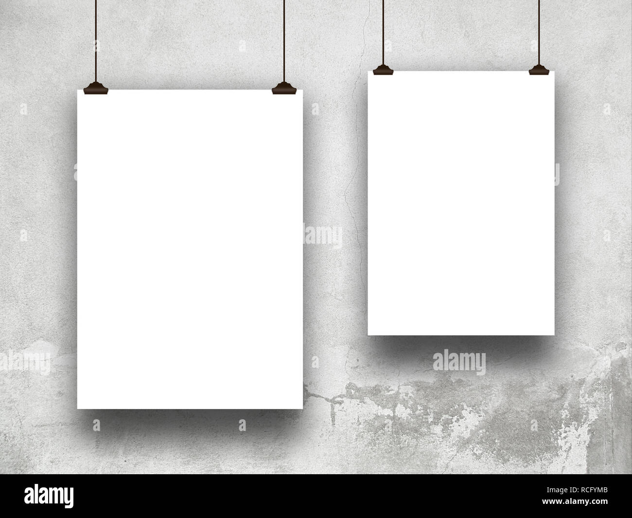 Two blank frames against gray concrete wall Stock Photo