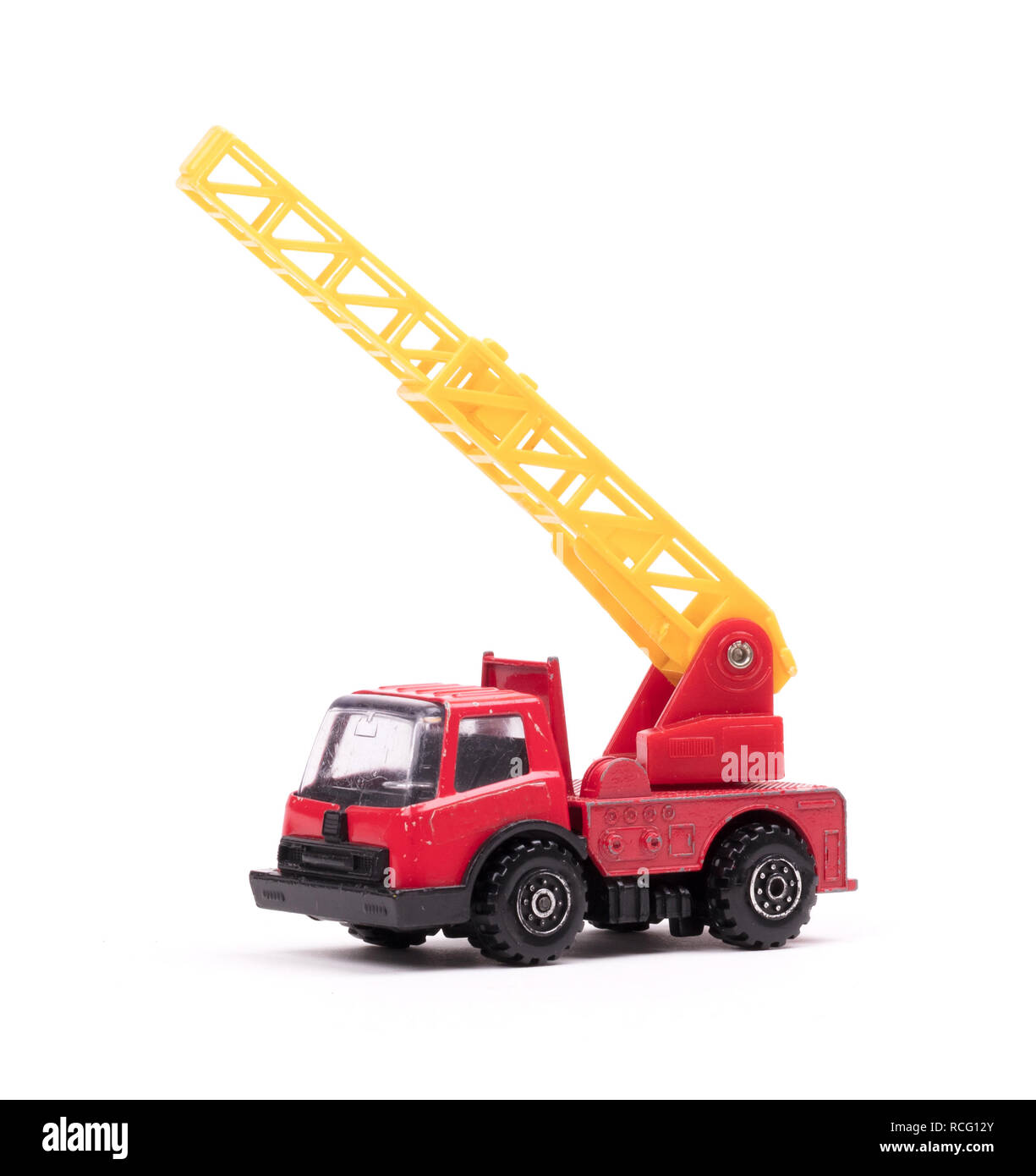 Toy firetruck with ladder extended on white background Stock Photo - Alamy