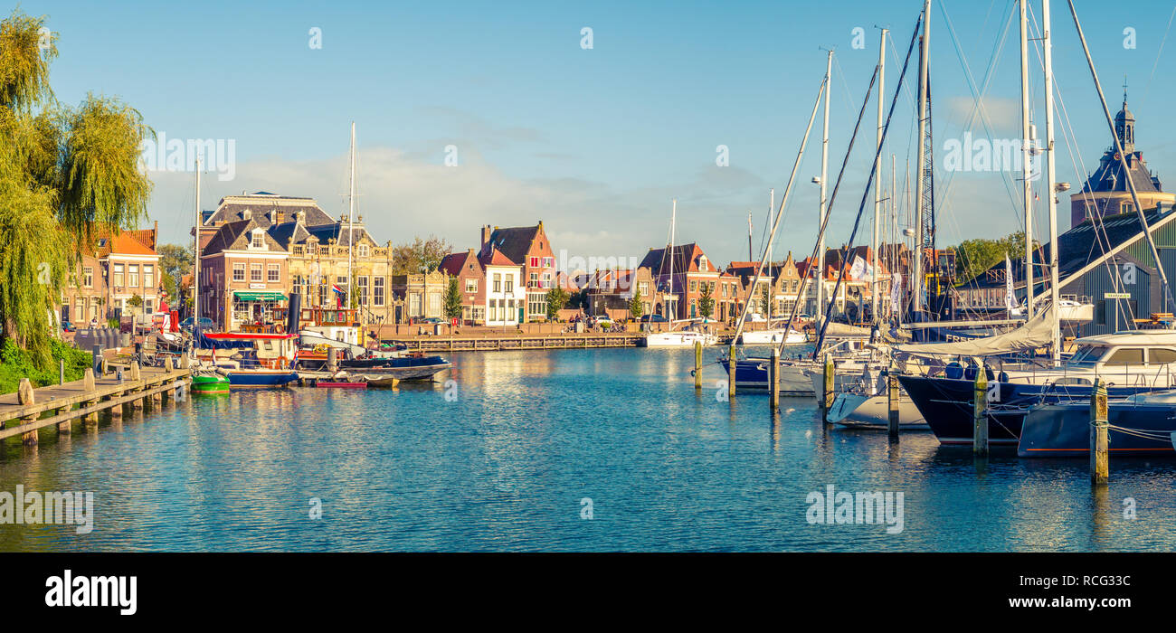 Panorama of old harbour with boats and quayside in historic city of Enkhuizen, North Holland, Netherlands Stock Photo