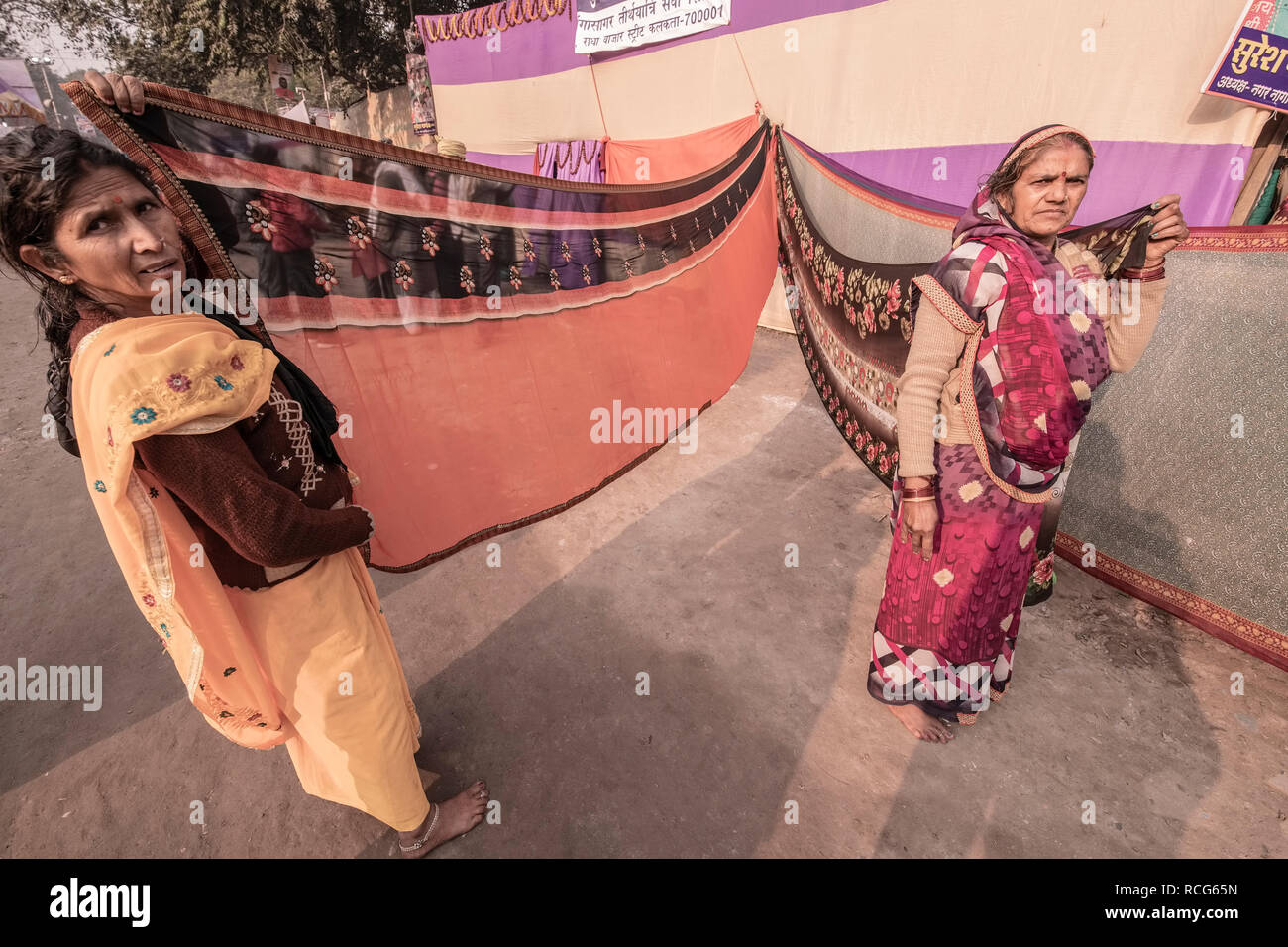 Gangasagar,Pilgrim,transit camp ,Kolkata,two elderly women,drying up sairs,at Campopen space,under Sun,India. Stock Photo