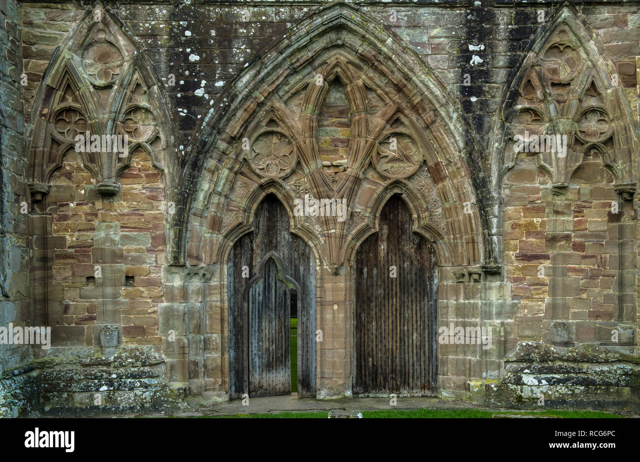 The east end of Tintern Abbey Wye Valley, up close. Beautifully carved sandstone arches. Stock Photo