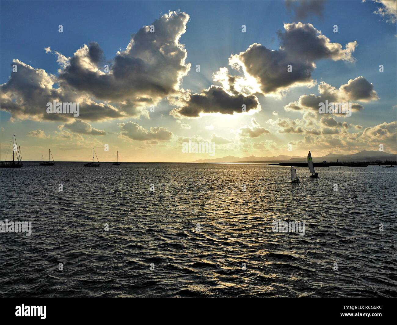 Beautiful sky just before sunset over sailing boats on the ocean at Arrecife, Lanzarote, Canary Islands Stock Photo