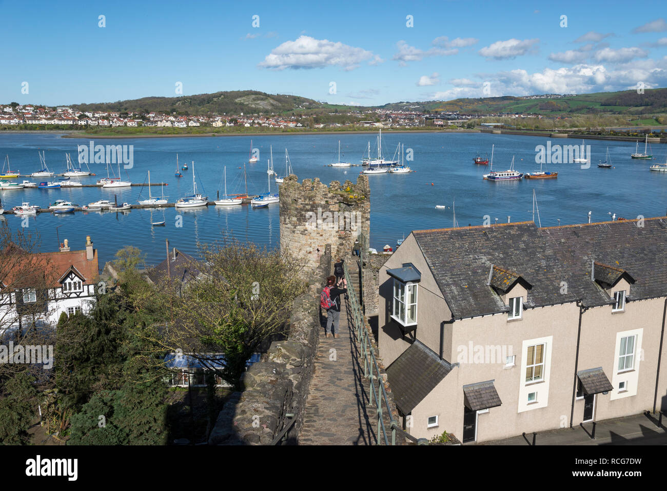 Old town walls at Conwy, North Wales. View of boats in the river near the harbour. Deganwy on the opposite side. Stock Photo