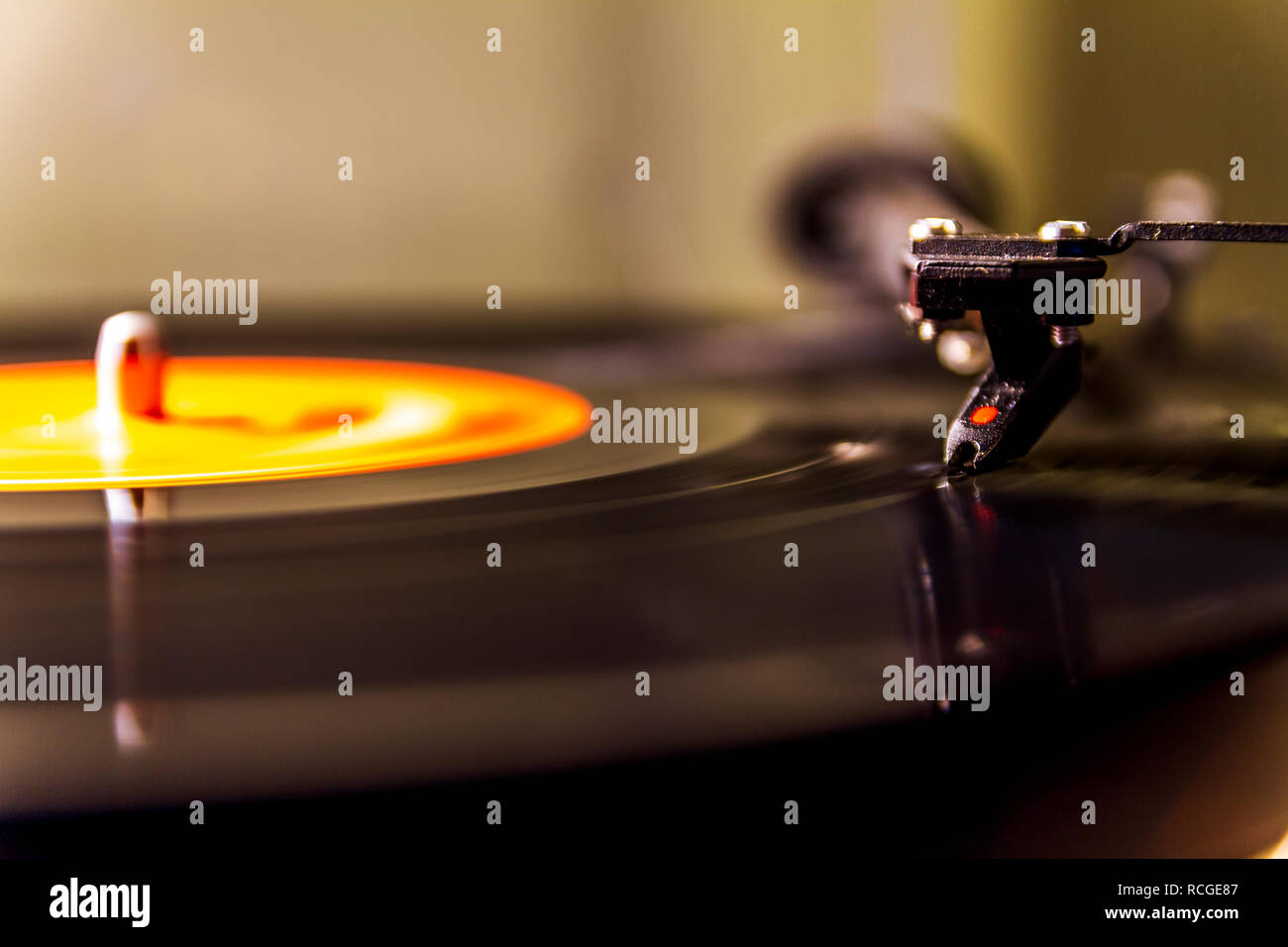 Vinyl lp record playing on a turntable isolated Stock Photo - Alamy