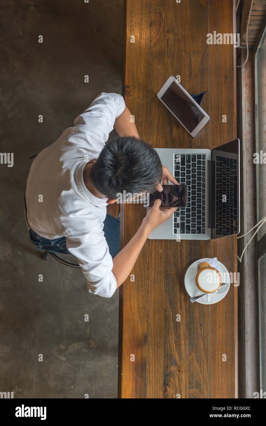 Professional young asian texting hi-res stock photography and images ...