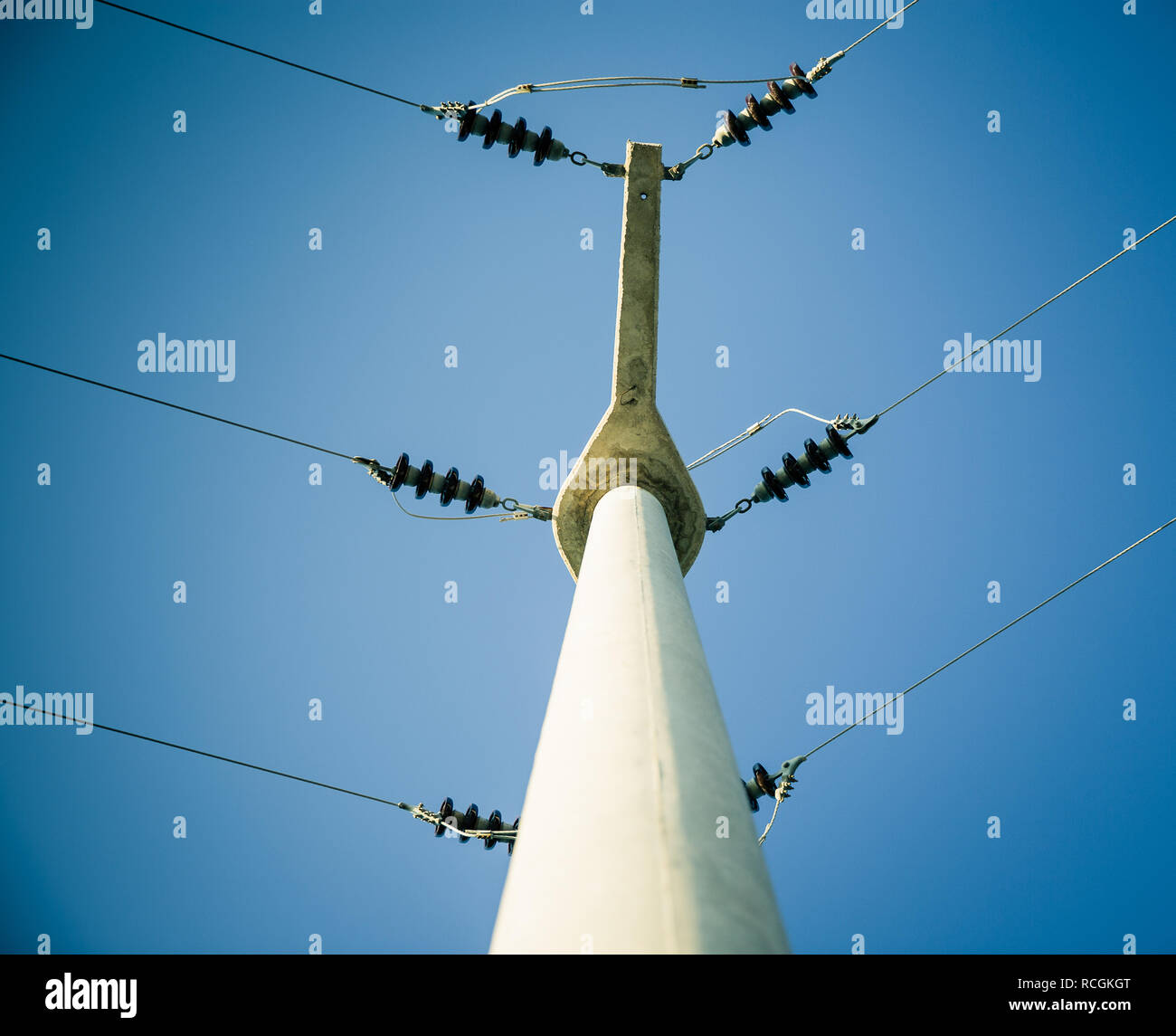 Power lines against a blue sky Stock Photo - Alamy