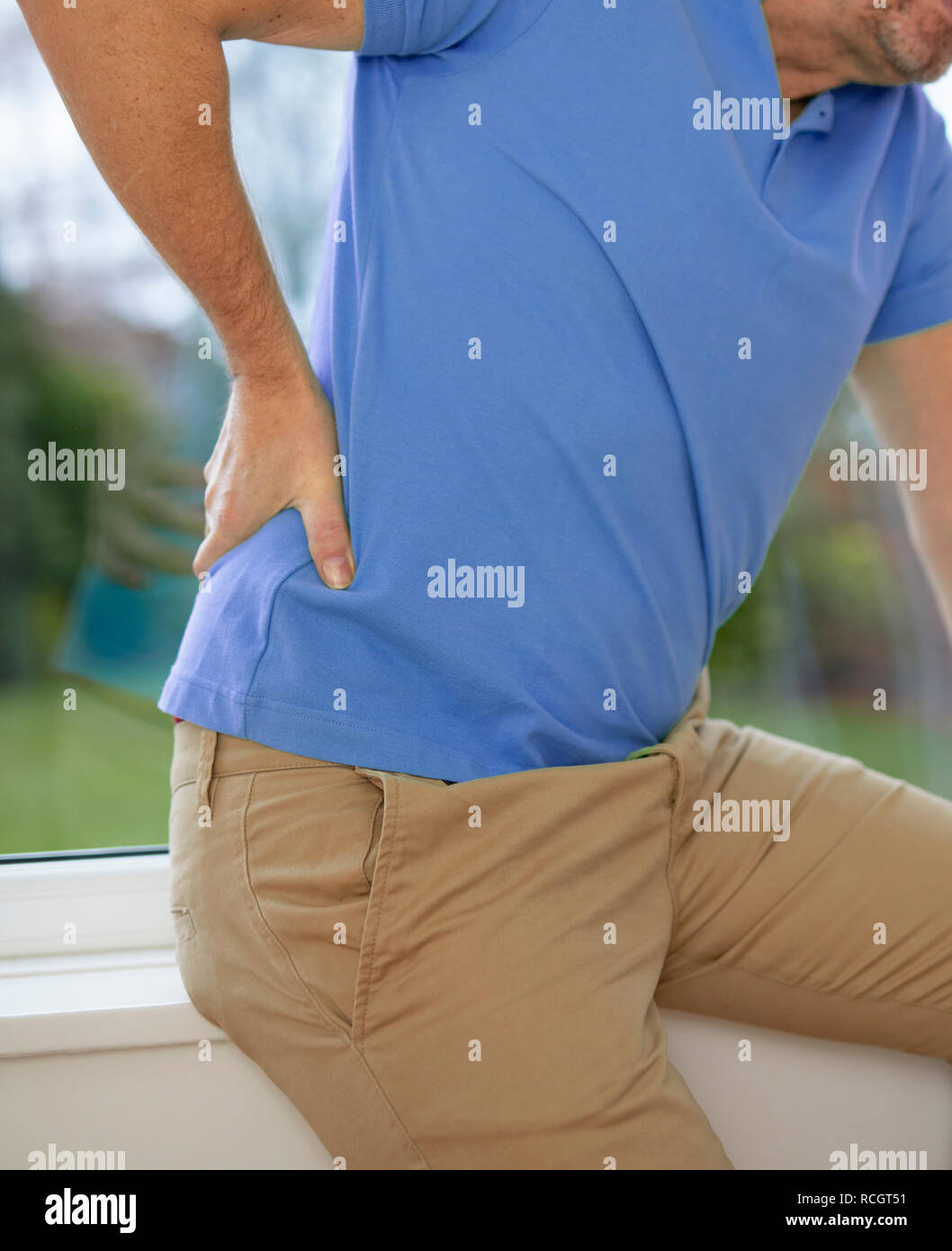 Man with back ache Stock Photo