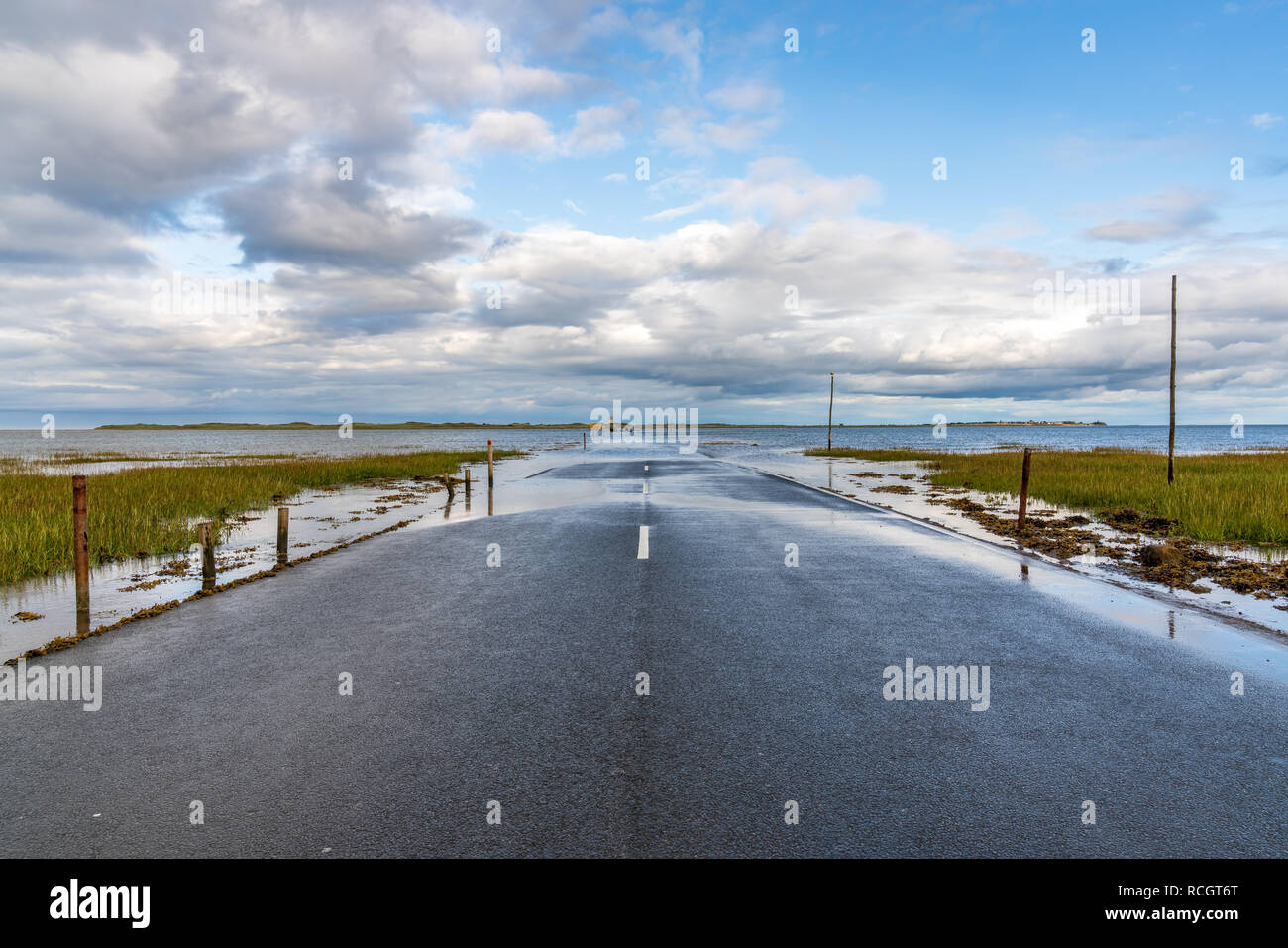 Flooded Road between Beal and the Holy Island of Lindisfarne in Northumberland, England, UK Stock Photo