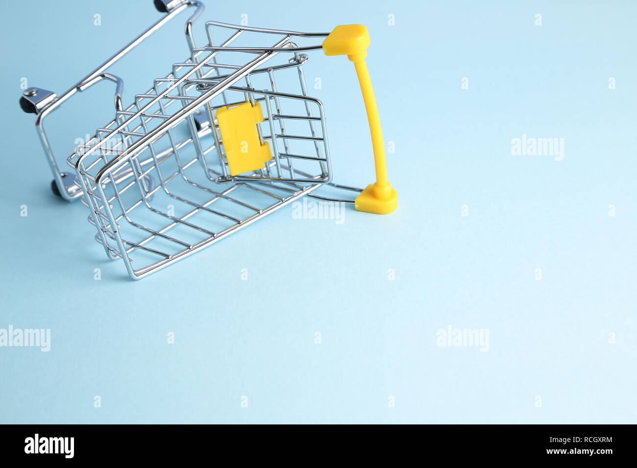Shopping cart on blue background. Business concept Stock Photo