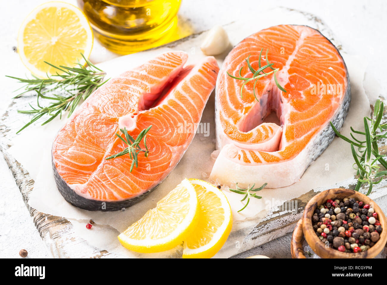 Fresh fish Salmon steak with spices on cutting board Stock Photo - Alamy