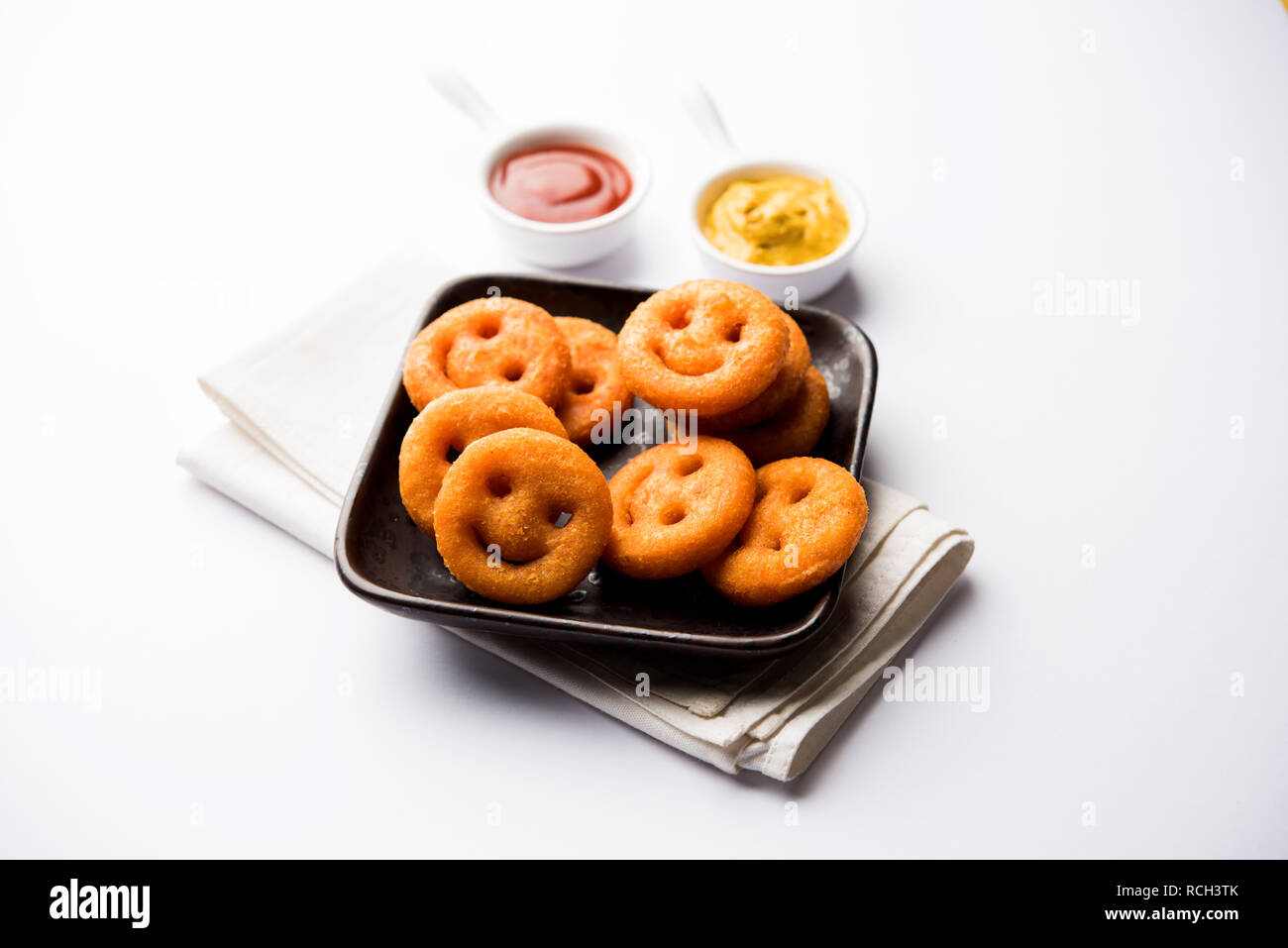 Crunchy potato smiling face snacks hi-res stock photography and images ...