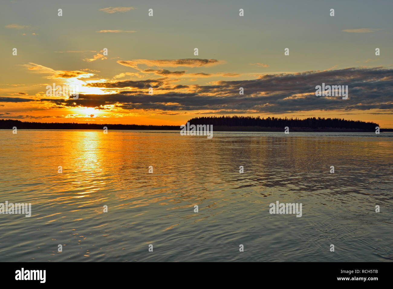 Sunset skies over the Mackenzie River, Fort Providence, Northwest Territories, Canada Stock Photo