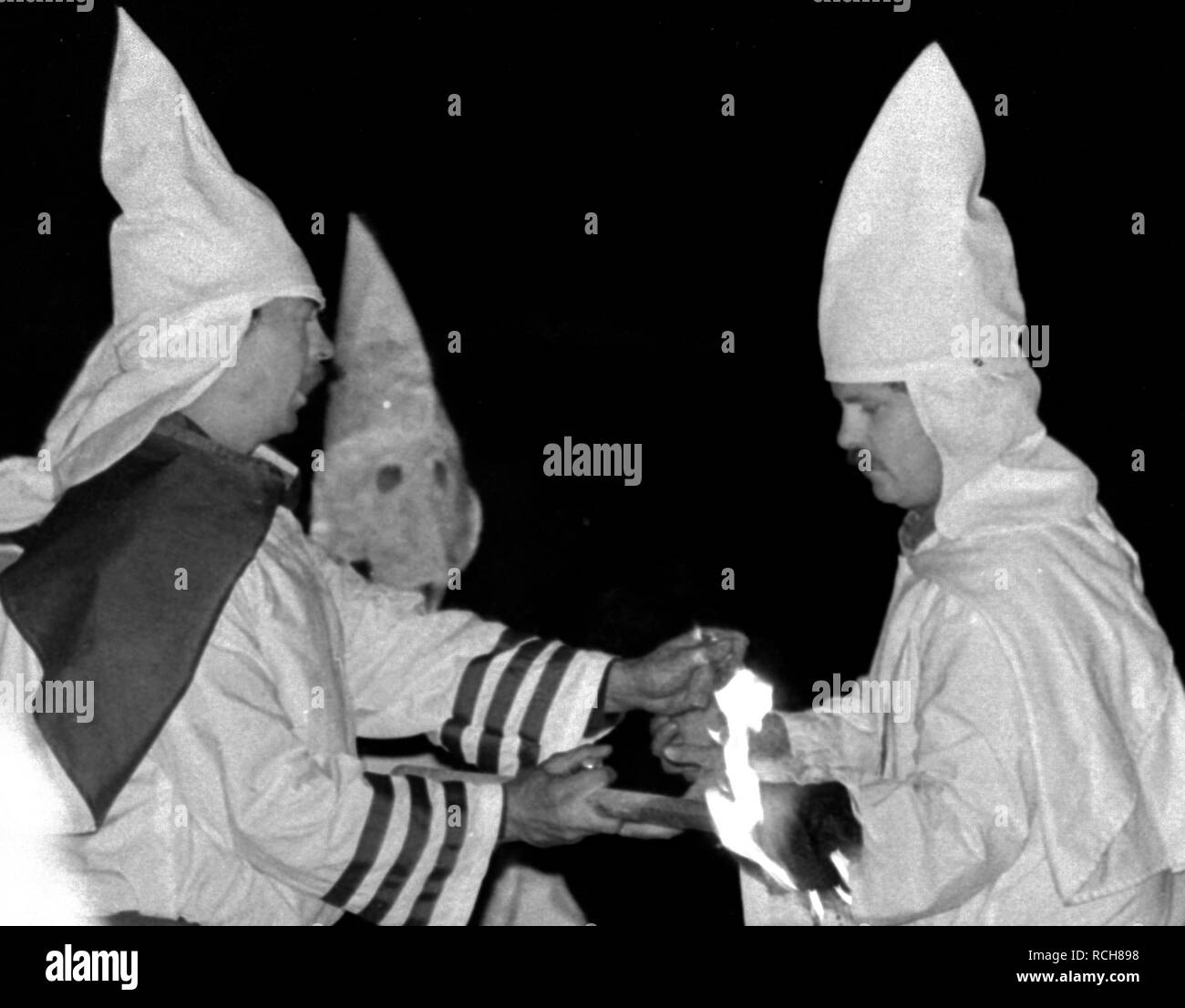 A Members of the KKK prepare to cross lighting in Rumford Me during rally in the small town Maine town. The Klan had been active in Maine in the 1920's and 30's , This group of Klansmen openly invited the press to observe ,photograph and report on this event photo by bill belknap Stock Photo