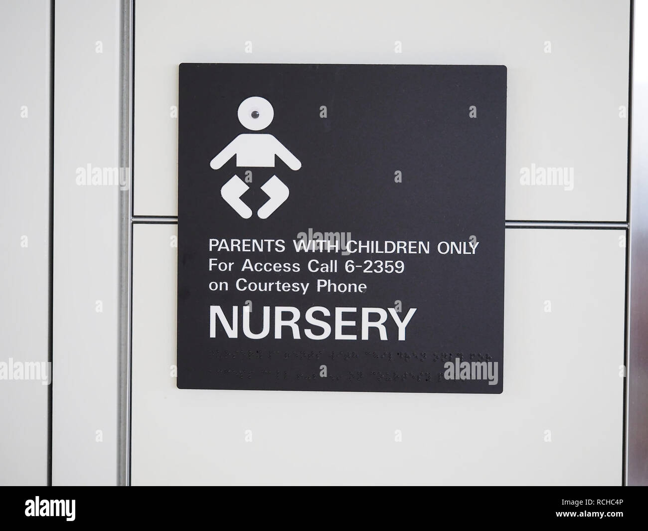 'Nursery - parents with children only' sign at San Francisco International Airport, August 2018 Stock Photo