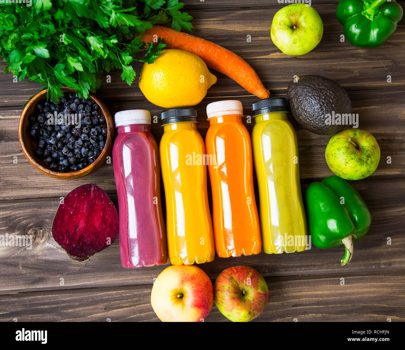 Healthy lifestyle concept with juice bottles, vegetables and fruits on