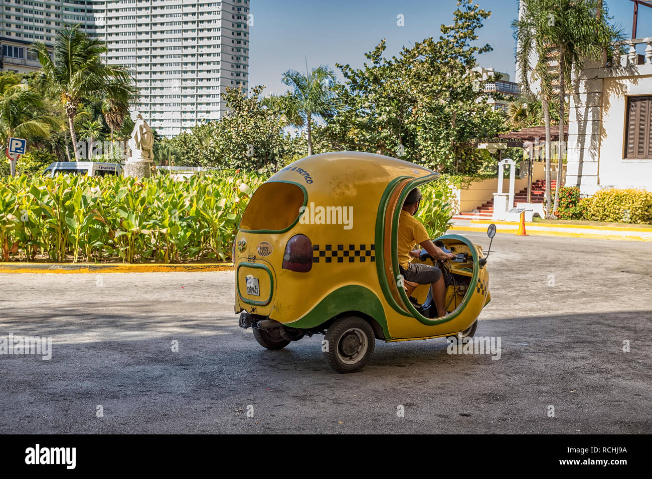 HAVANA, CUBA - December 08.2018: Typical Cuban motorbike taxis are known as Coco taxi in Havana, Cuba. Stock Photo