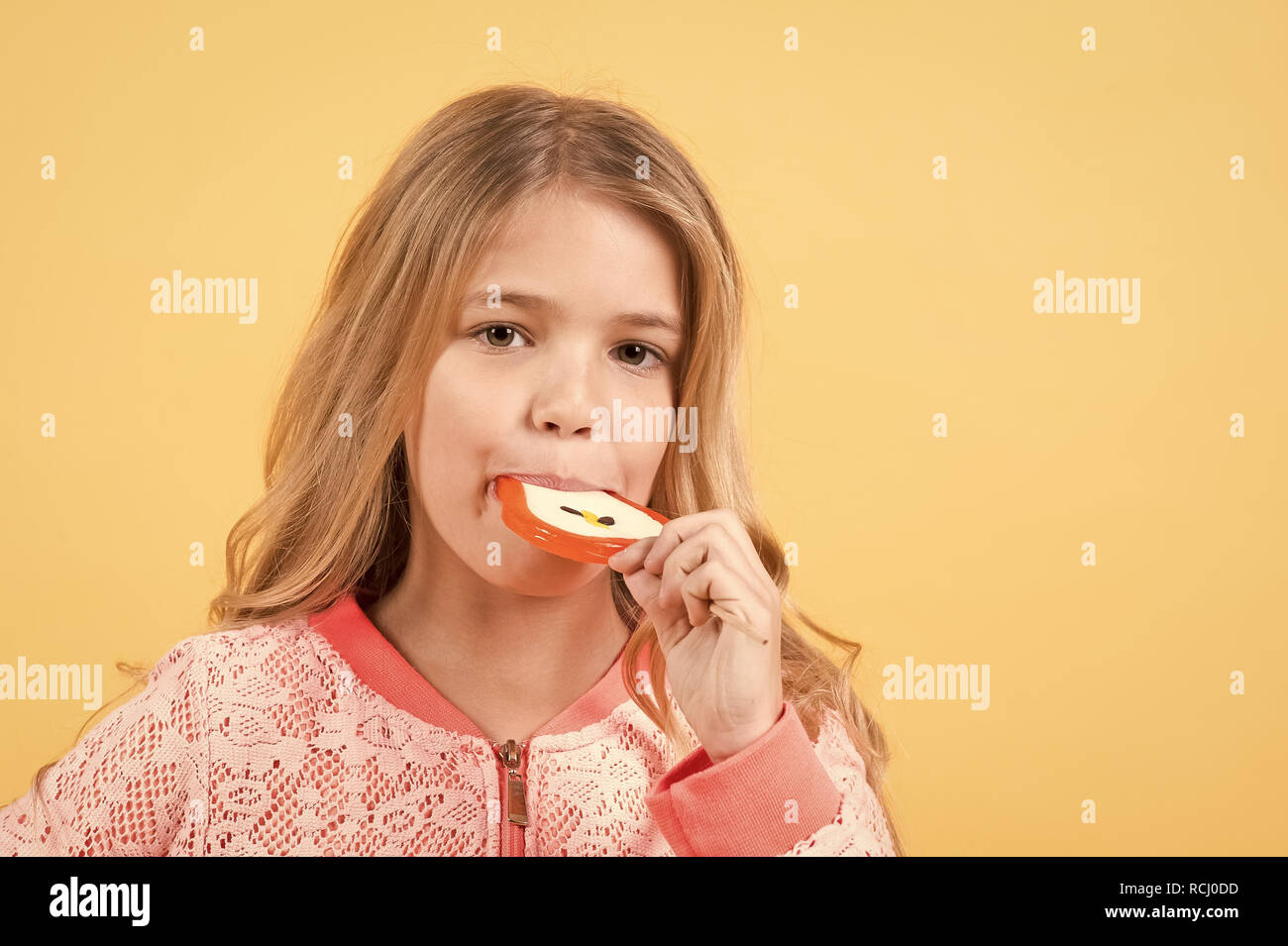Child eat candy on stick, food. Little girl with lollipop, snack. Food