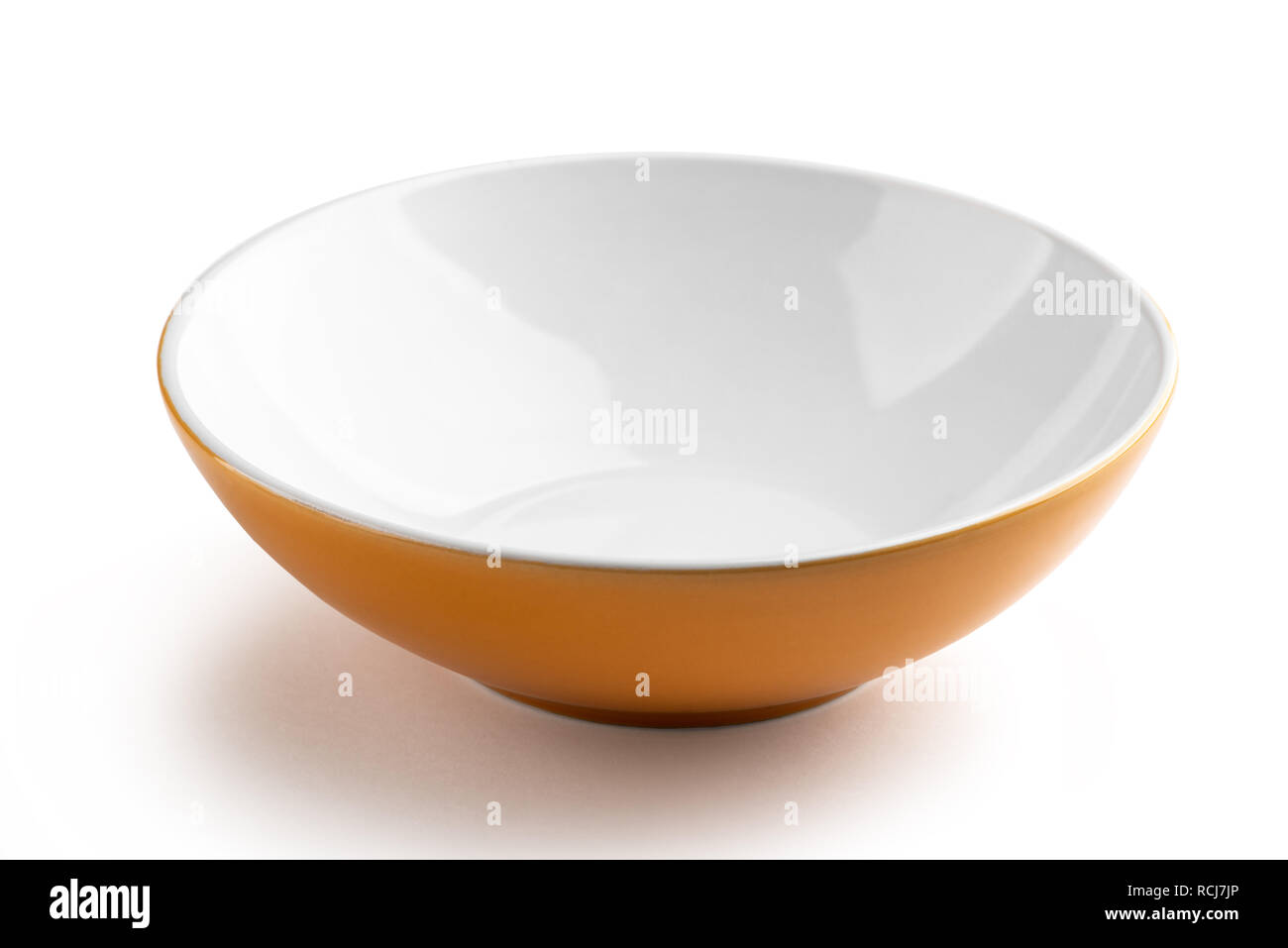 Orange soup plate on white Stock Photo