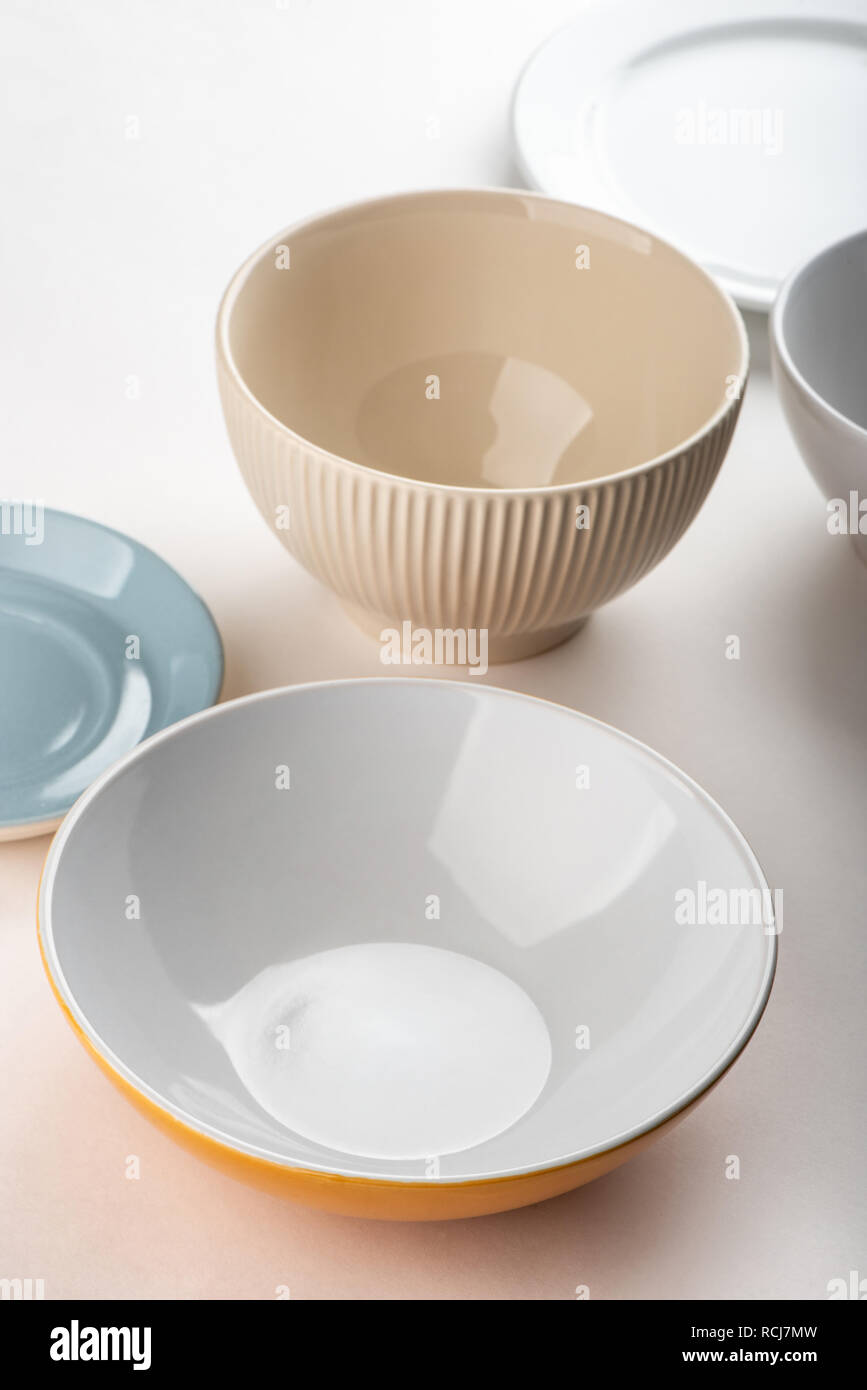 Different bowls on white background. Stock Photo