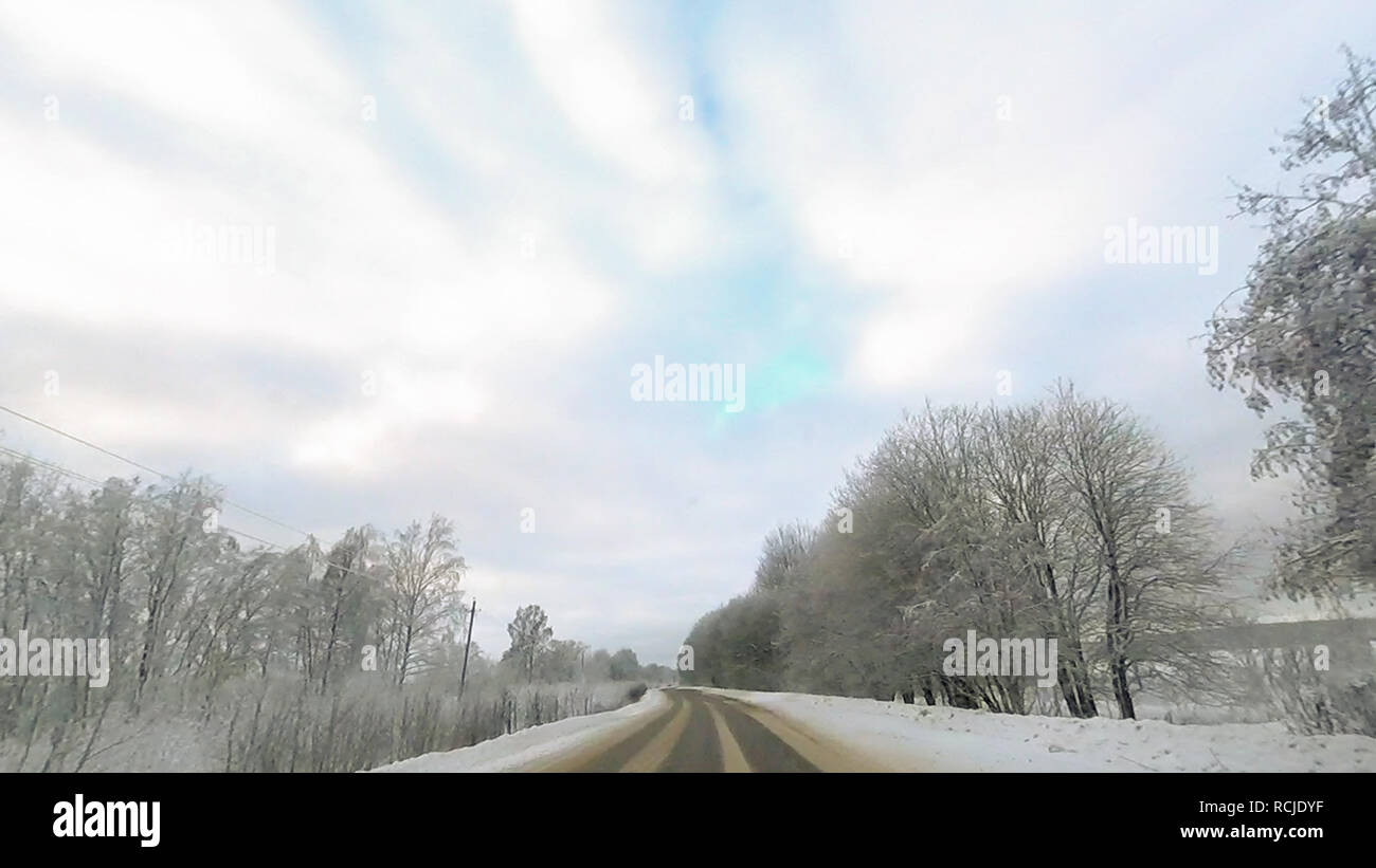 Country road in winter along the forest with white snow trees Stock ...