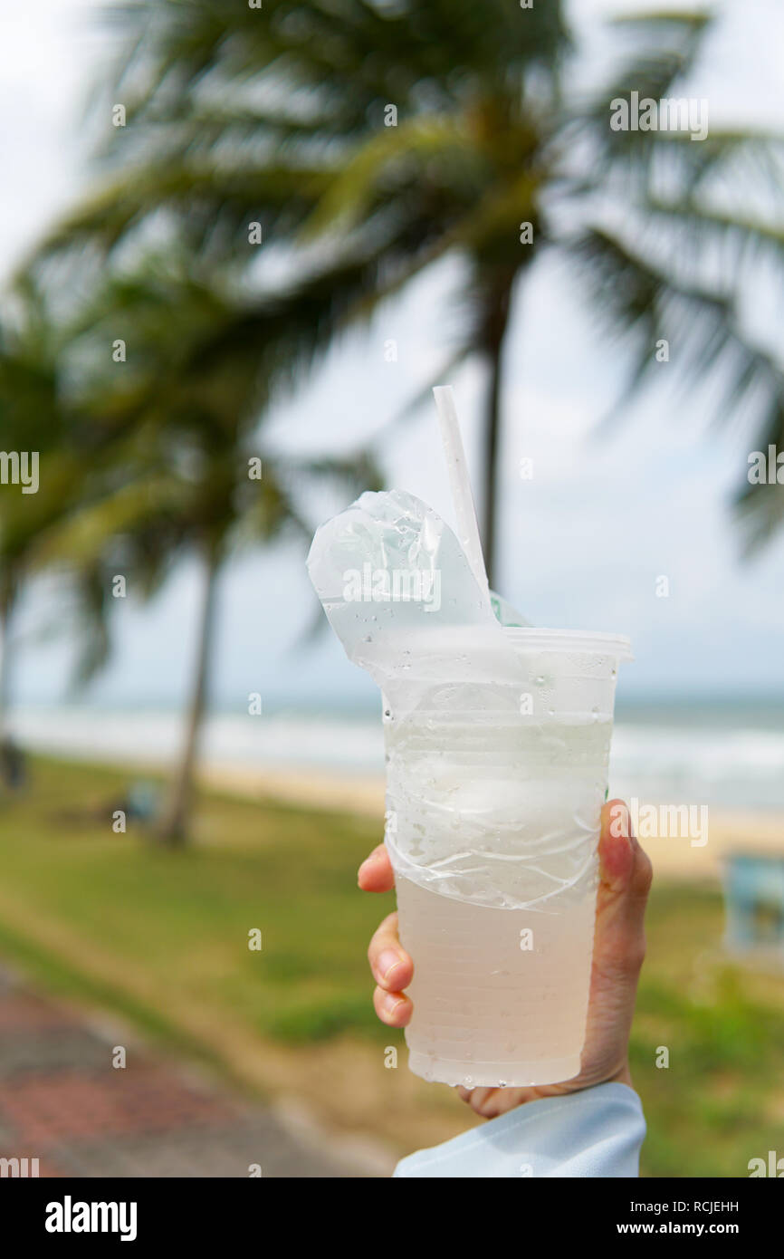 Coconut juice,Drink coconut water in transparent plastic container with