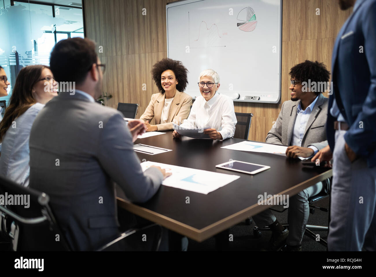 Group of successful business people at work in office Stock Photo - Alamy