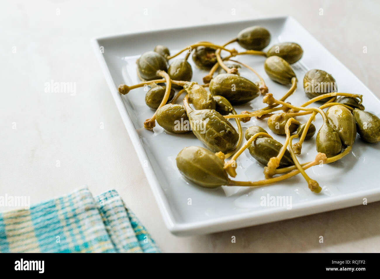 Pickled and Canned Capers Ready to Eat in Plate. Organic Food Stock