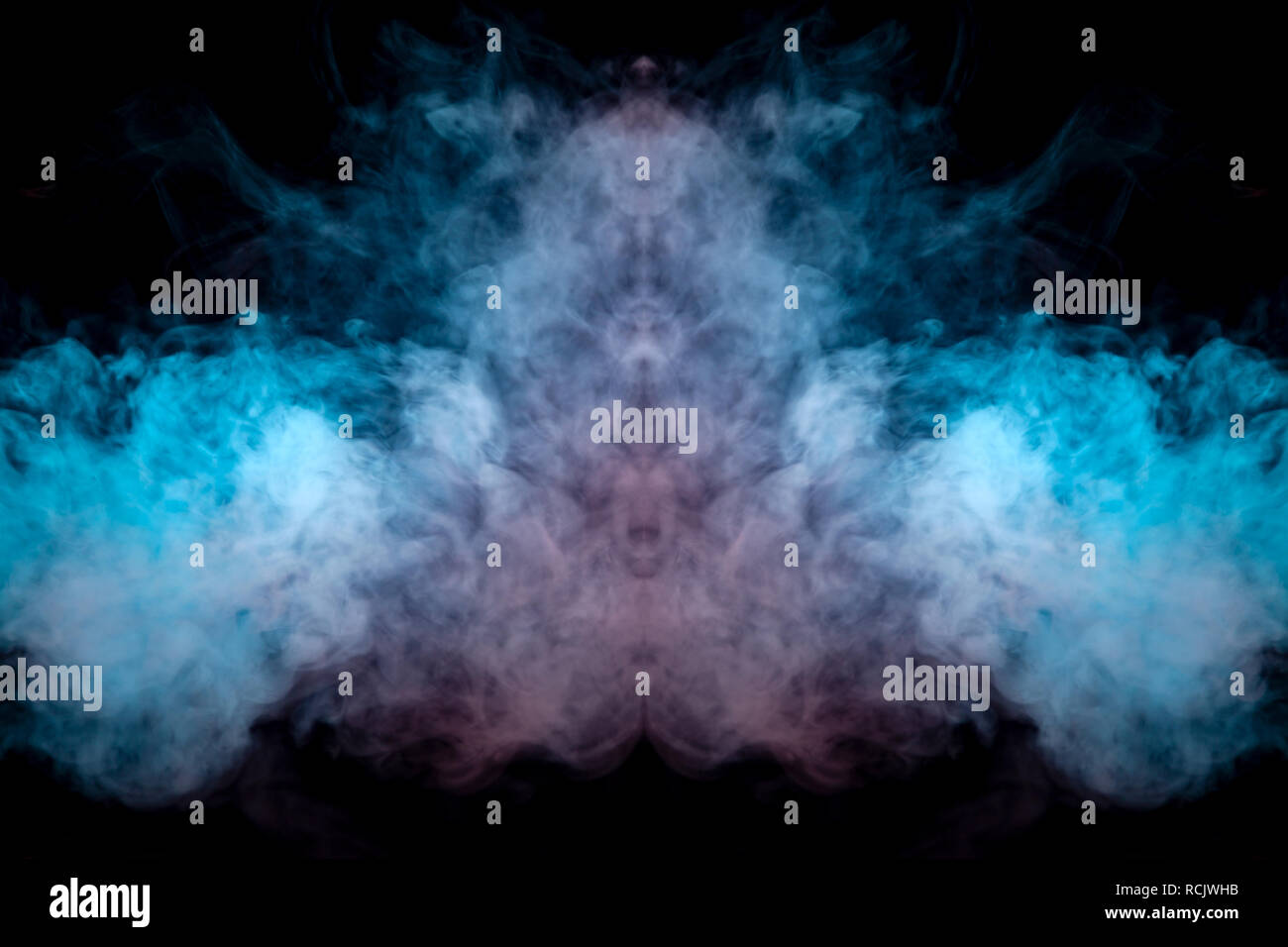 The thick smoke exhaled from the vape is highlighted by a blue-violet color  like a head against a black background dynamically in a rising column of s  Stock Photo