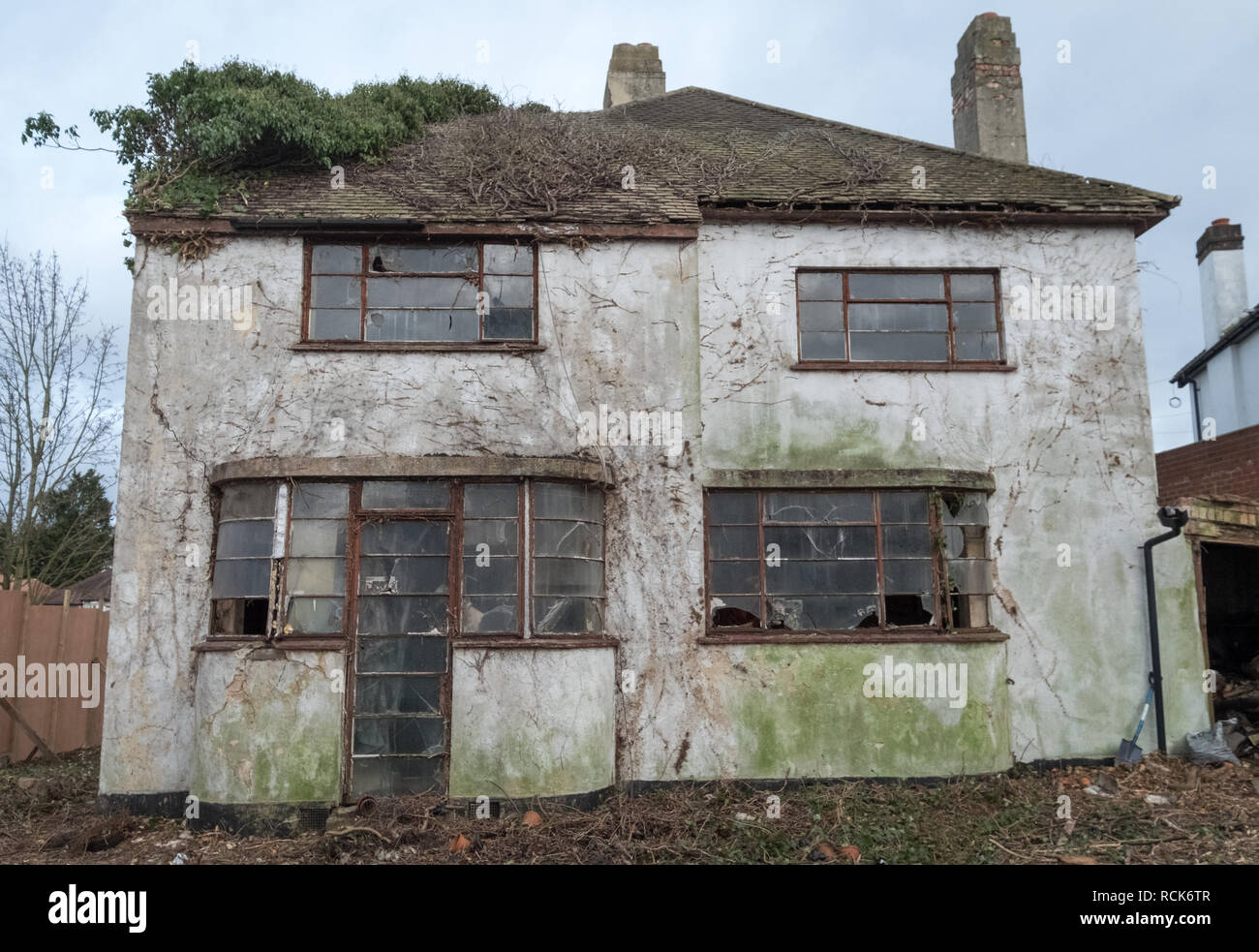 Exterior of derelict house built in 1930's deco style. House is due for