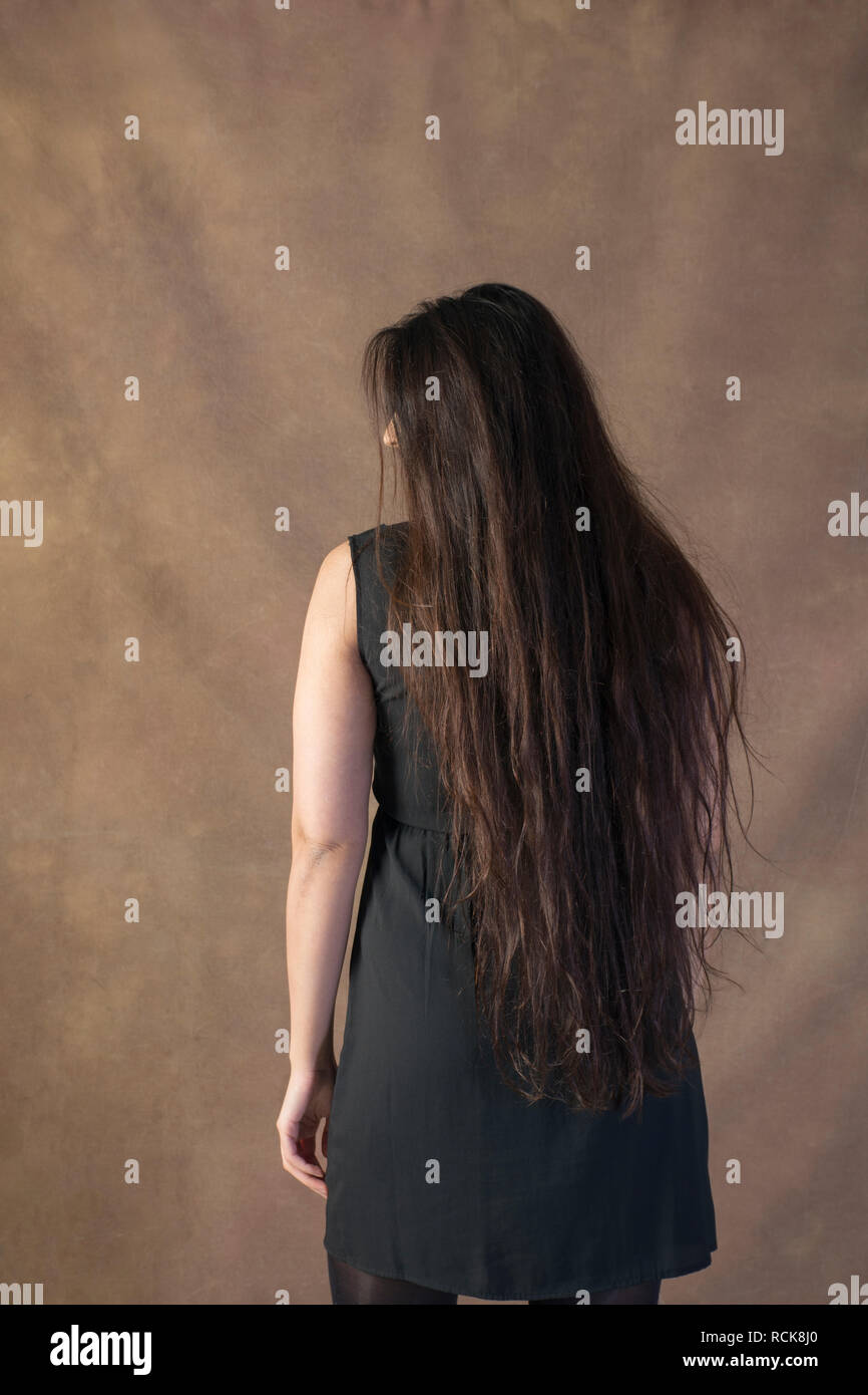 Rear view of a woman with long hair Stock Photo - Alamy
