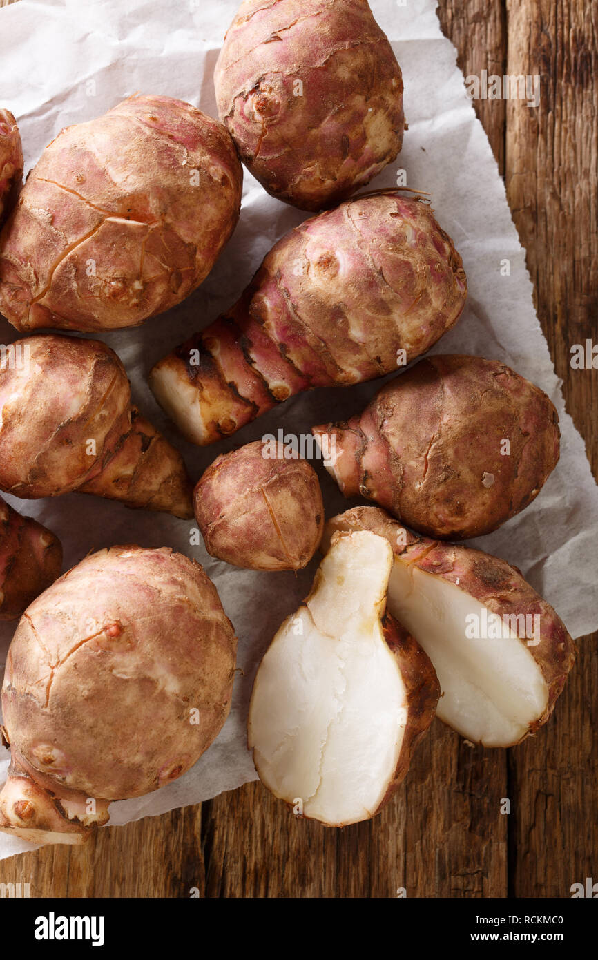 Jerusalem Artichoke Also Called Sunroot Sunchoke Earth Apple Or Topinambour Close Up On The Table Vertical Top View From Above Stock Photo Alamy