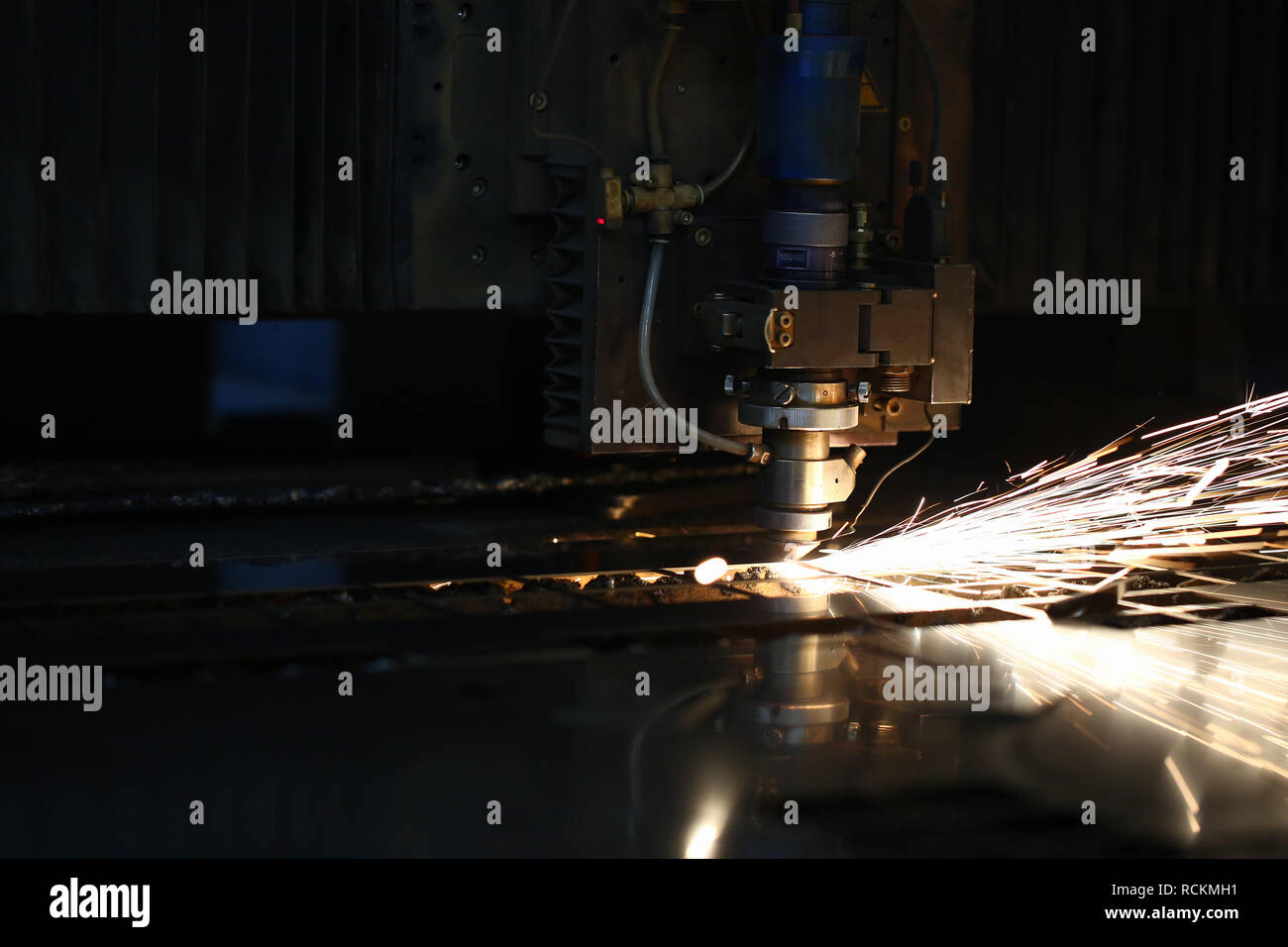 Sparks fly out machine head for metal processing Stock Photo