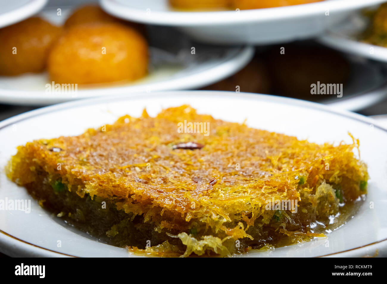Turkish dessert with walnut. Close up turkish shredded wheat dessert