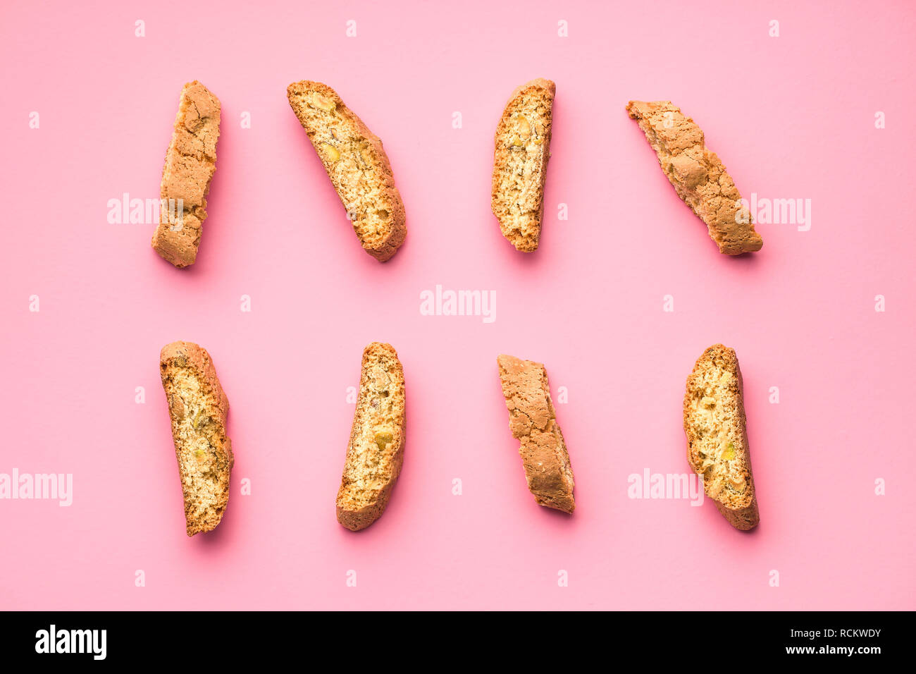 Sweet cantuccini biscuits. Italian biscotti on pink background. Top ...